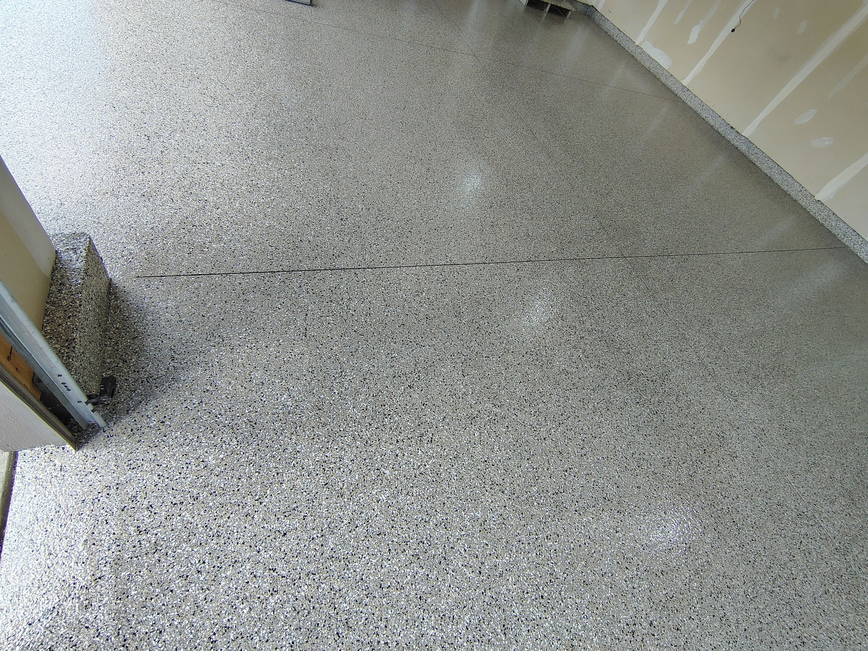 Multi-Car Garage Concrete Coating and Epoxy Finish in Sioux Falls by Select Painting, Coatings & Garage Cabinets