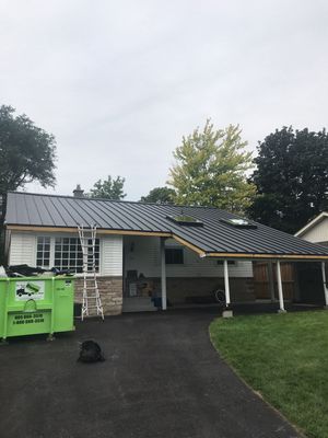 Residential Roofing Installation using 16" Standing Seam Panels