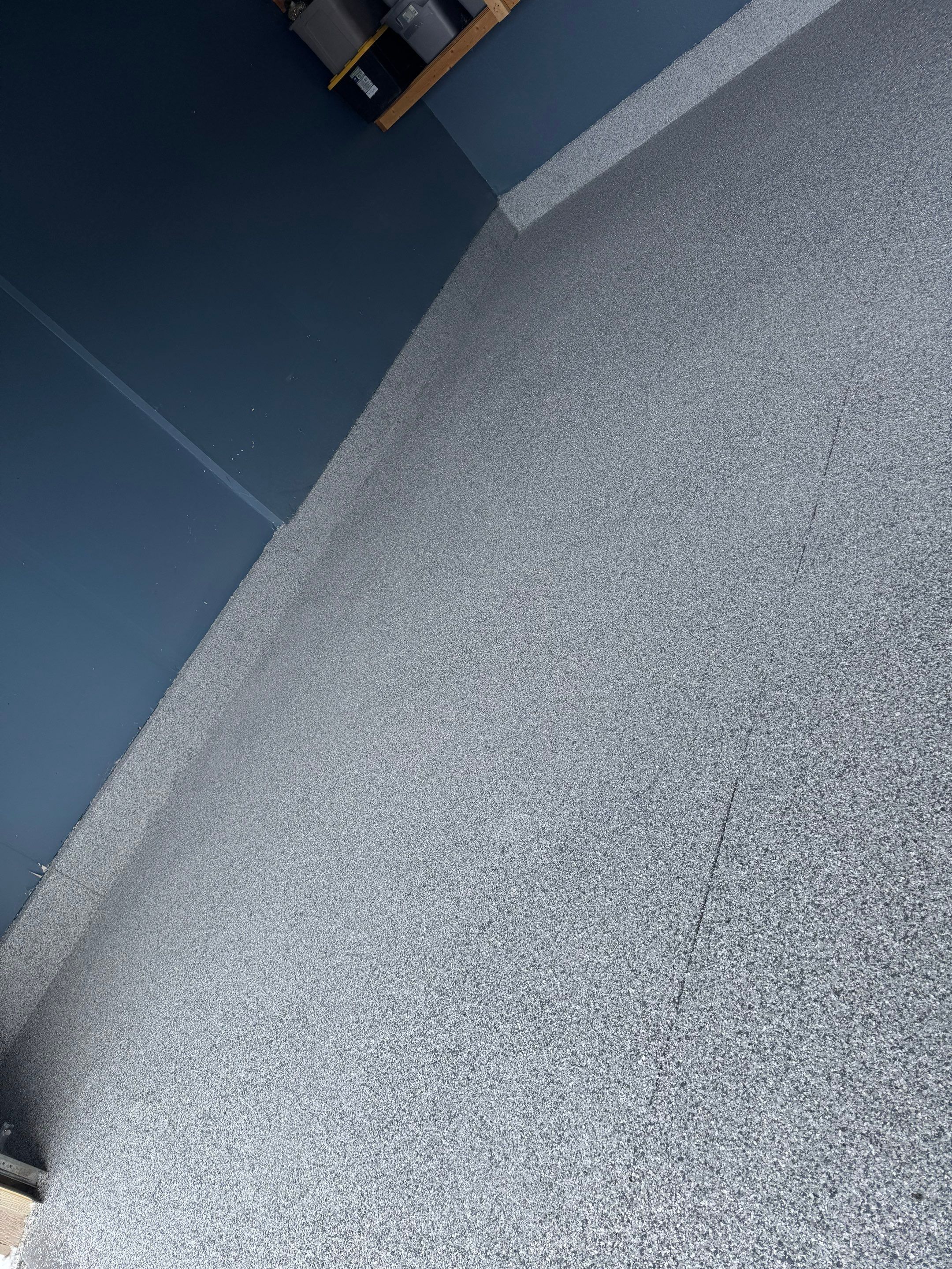 Grey Speckled Epoxy Garage Floor and Stair Coating in Sioux Falls by Select Painting, Coatings & Garage Cabinets