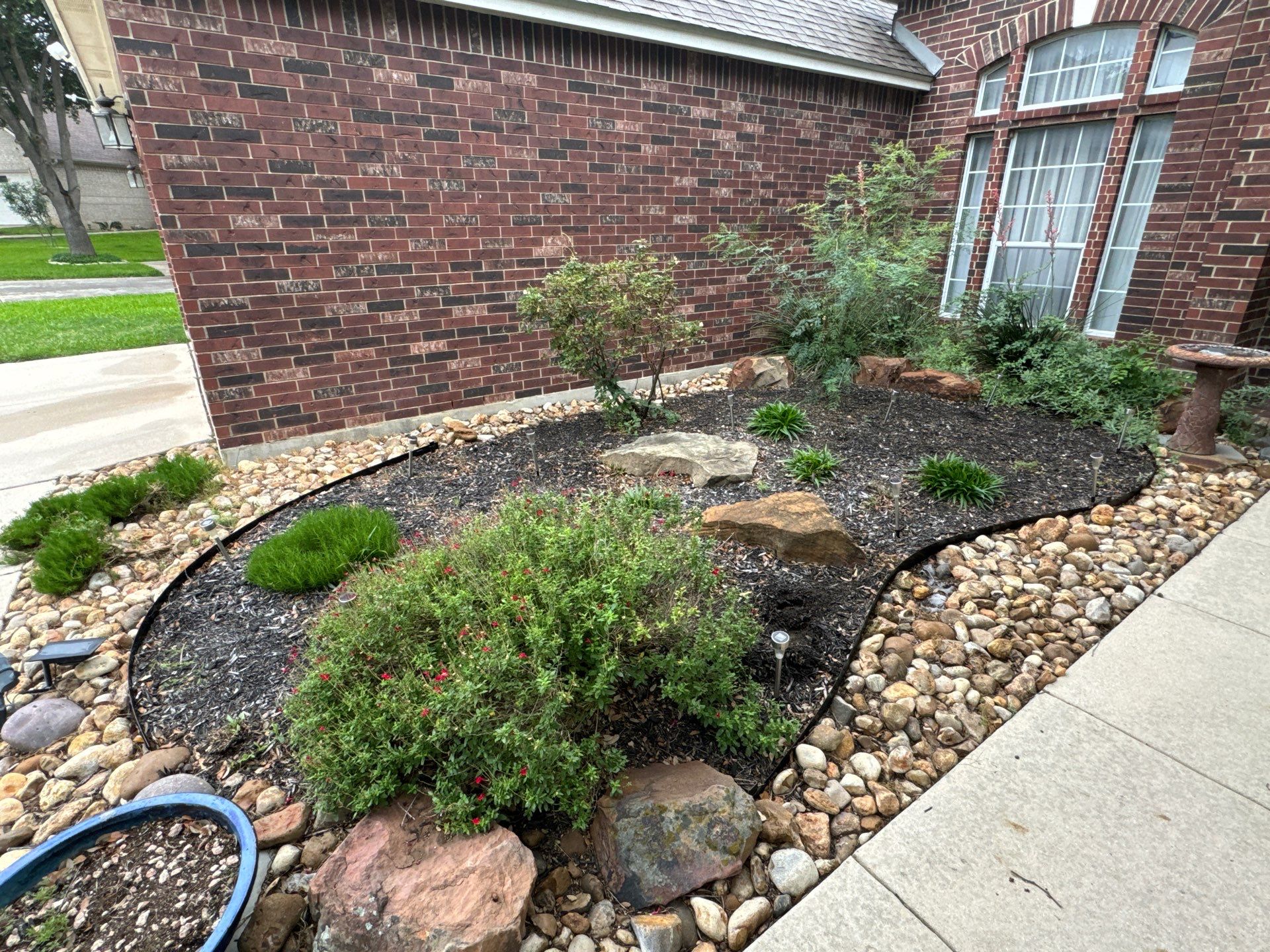 Landscaping Enhancement  using Texas Black Gravel by Hole In One Lawns, LLC