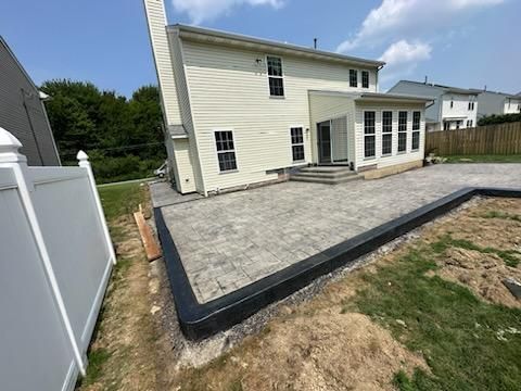 Stamped Concrete, Entry Door, and Concrete  by Ivy Lea Construction