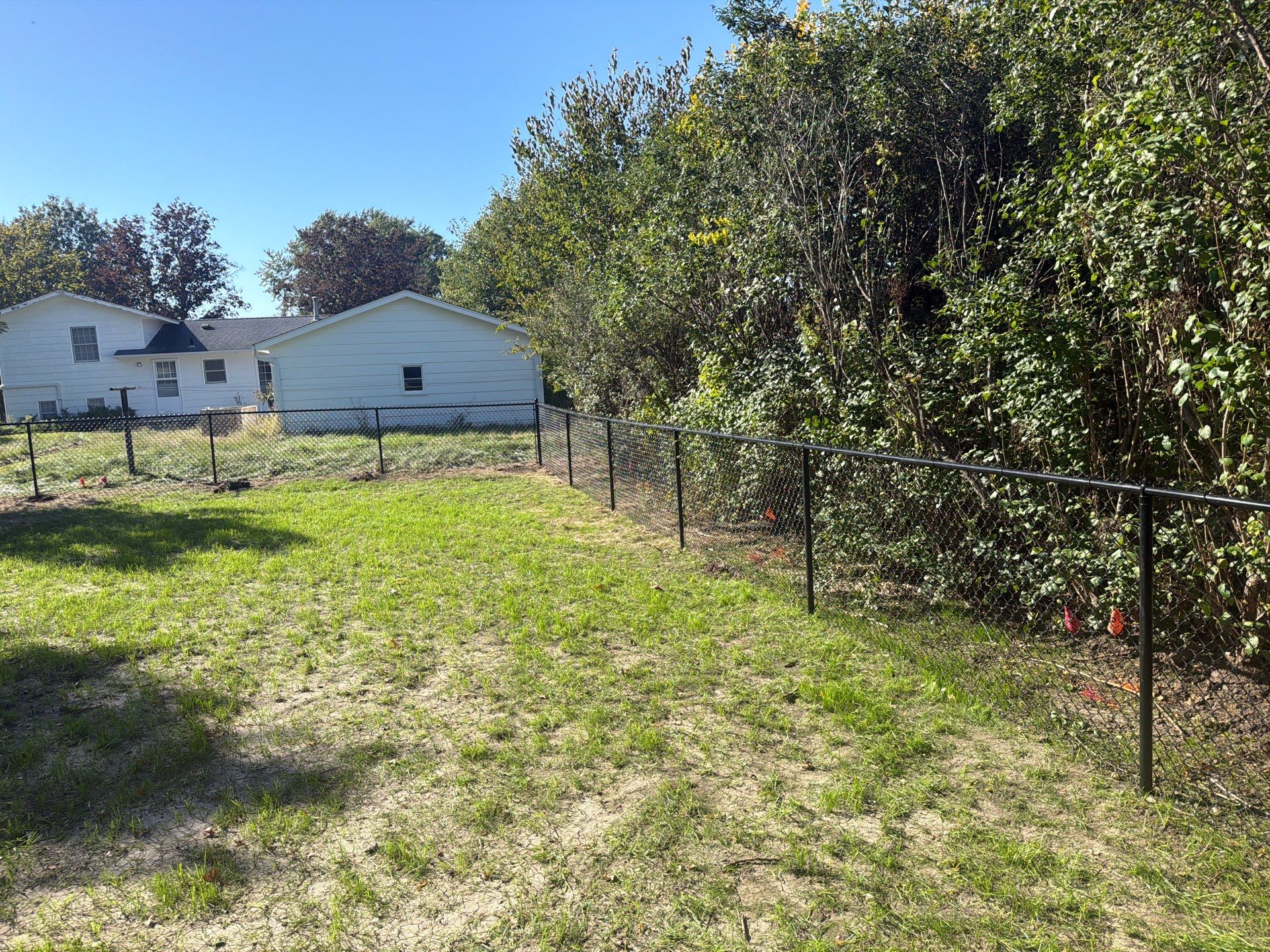 Black Chain Link Fence Installation with Double Gate in Cedar Falls by Perfect Picket Fence and Stain