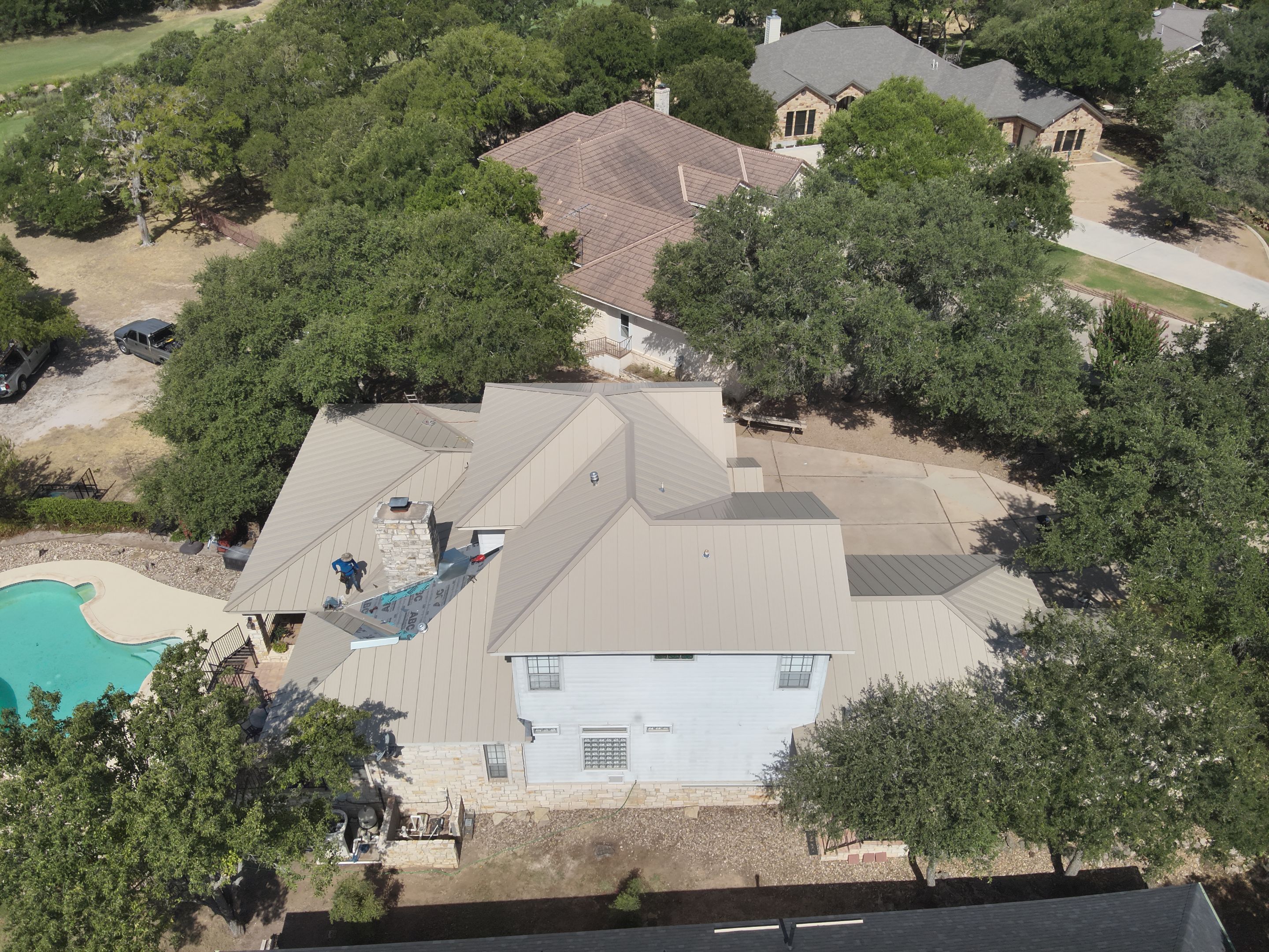 Residential Roof Replacement using 24 GA Double-Lock - Surrey Beige by Action Exteriors Austin