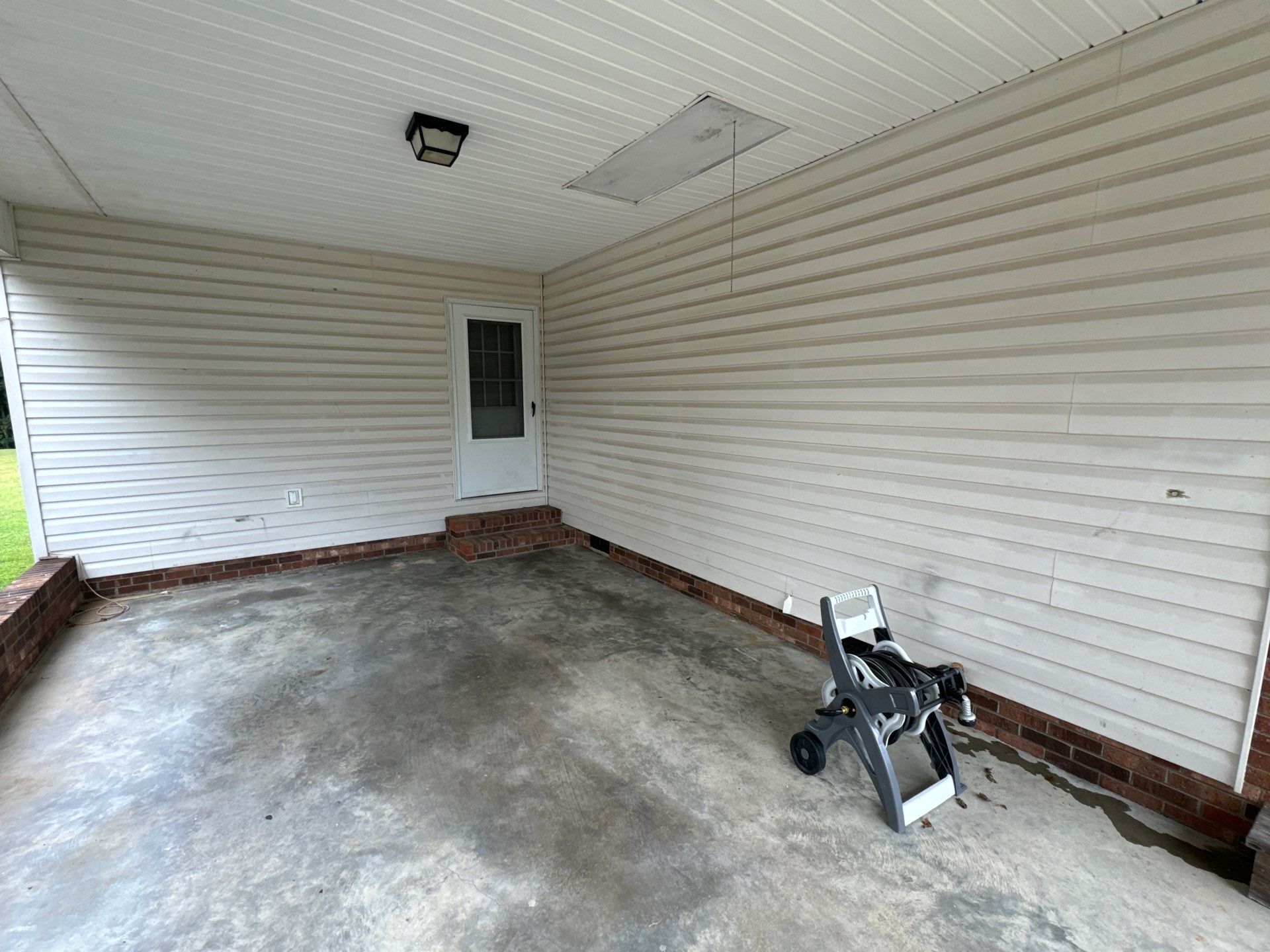 the service shown is pressure washing of the concrete floor and exterior siding to remove dirt and grime