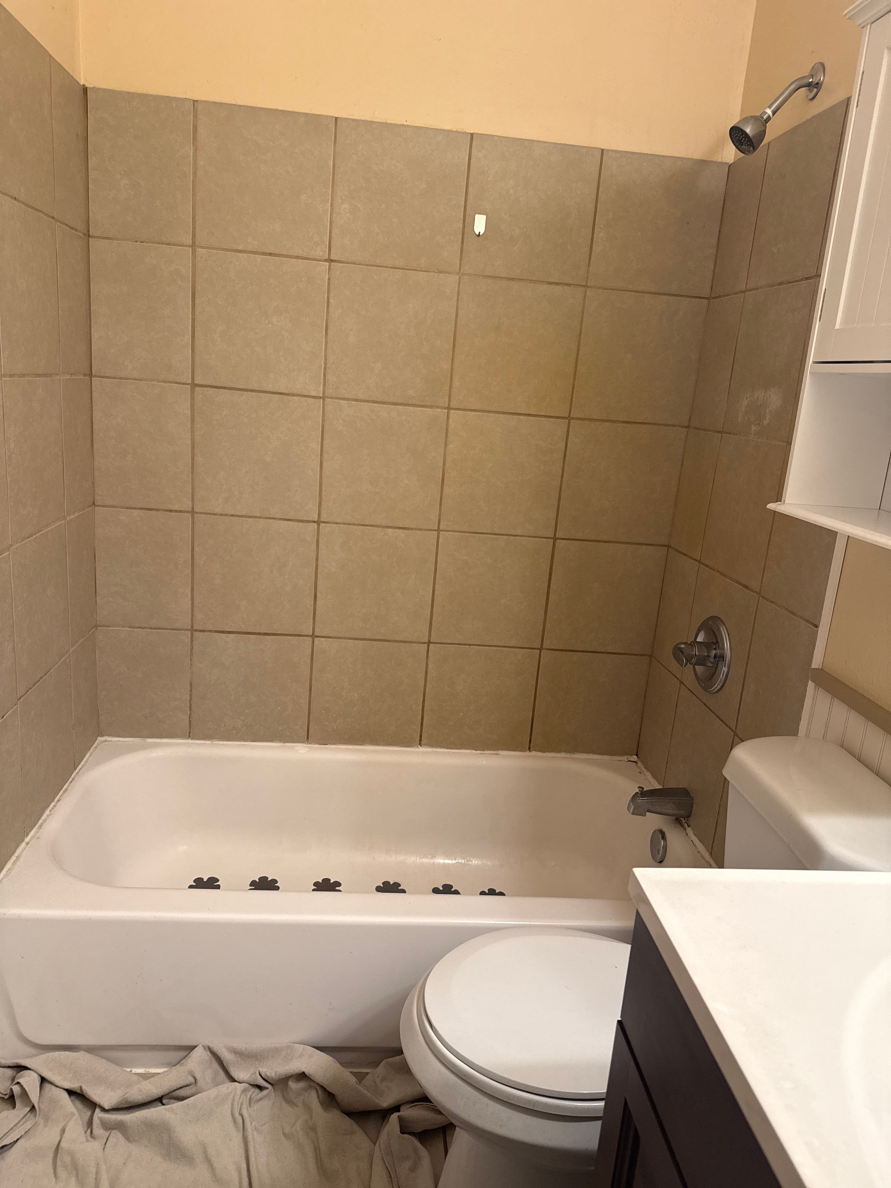 Prudenville Bath Remodel with Stone-Look Shower by Rainbow Seamless Systems