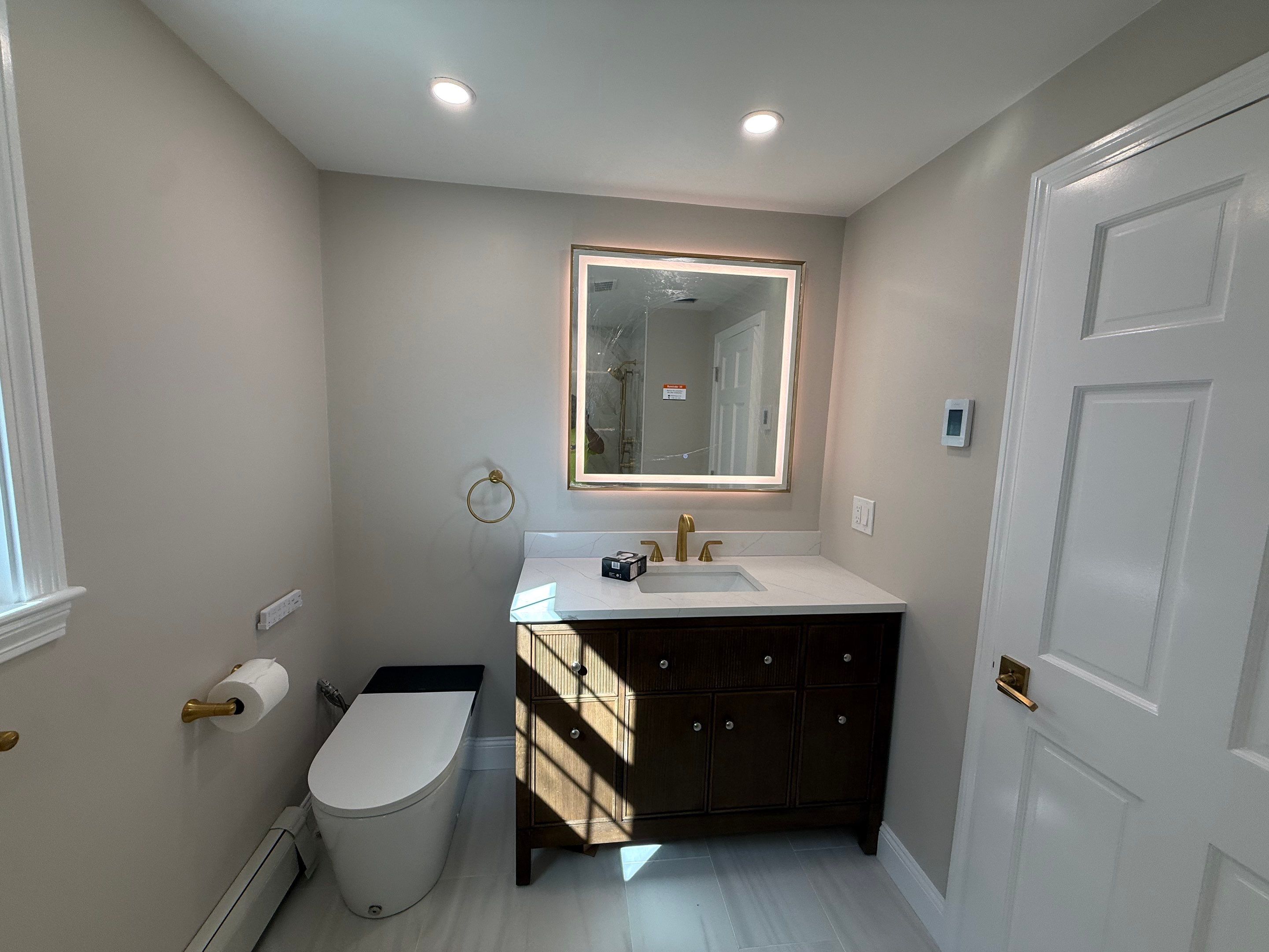 Bathroom renovation in Dedham, MA by Us Propaint And Renovation