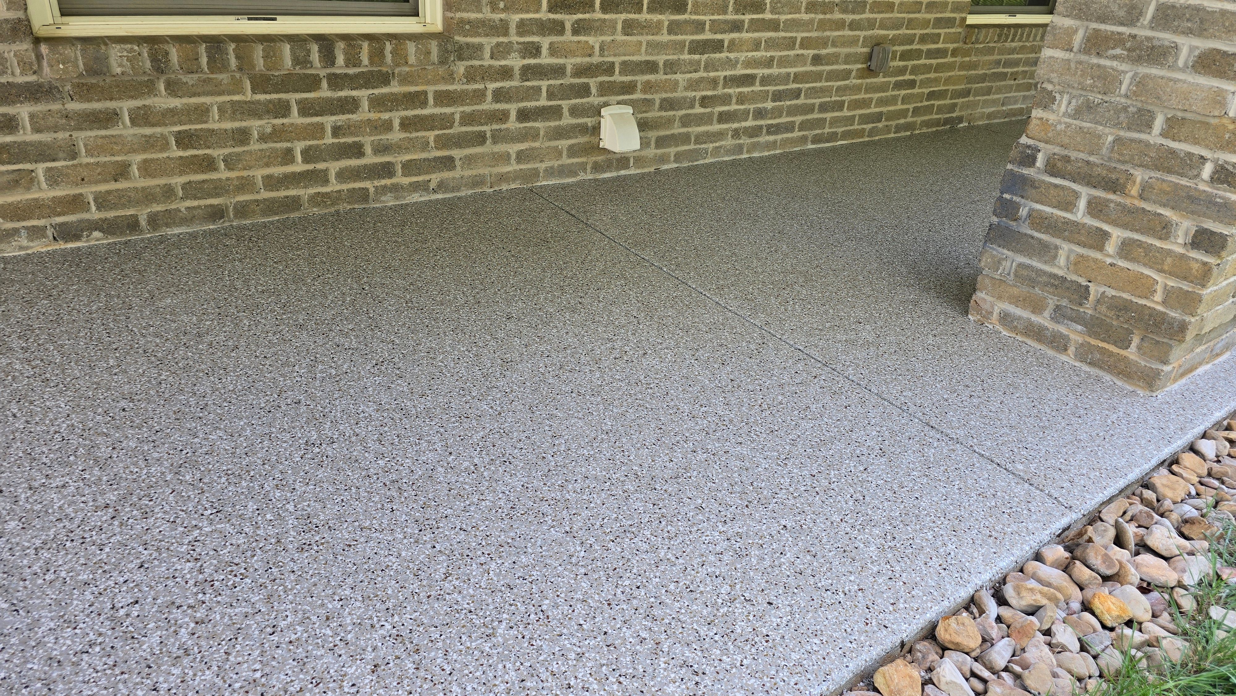 Back Patio using Creekbed by Elite Floor Solutions