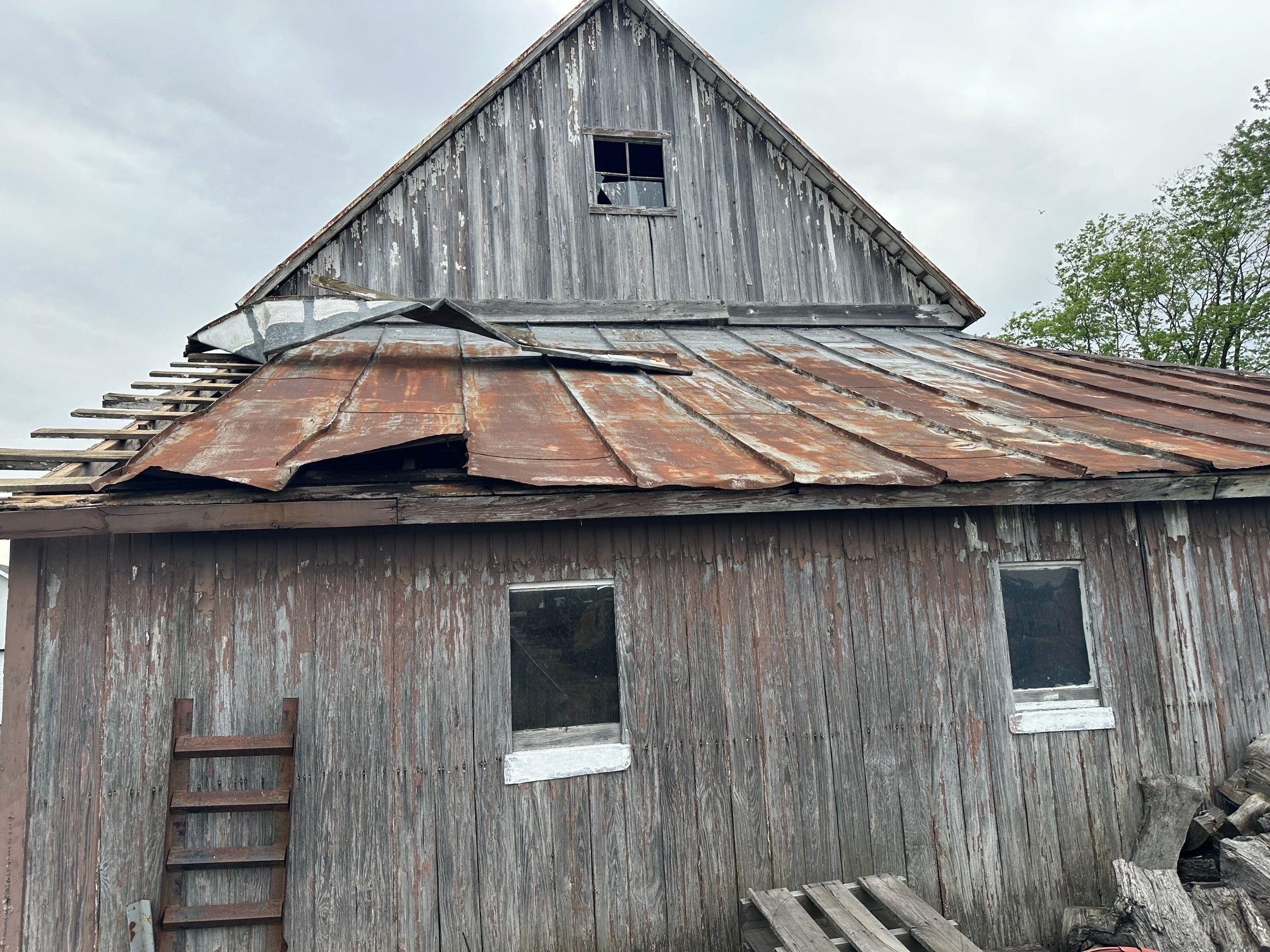 Residential Roofing Installation using Standing Seam Metal - Barn Red by RoofX 