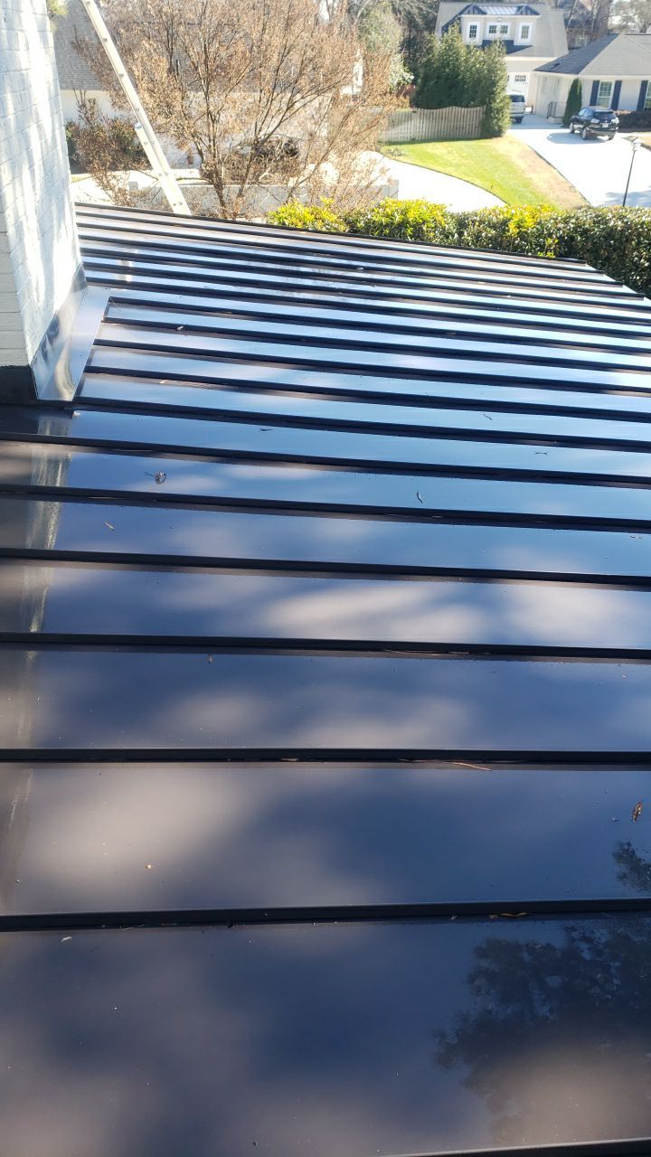 Sara Gutter cleanout using water by G&H Home Tech Pros LLC