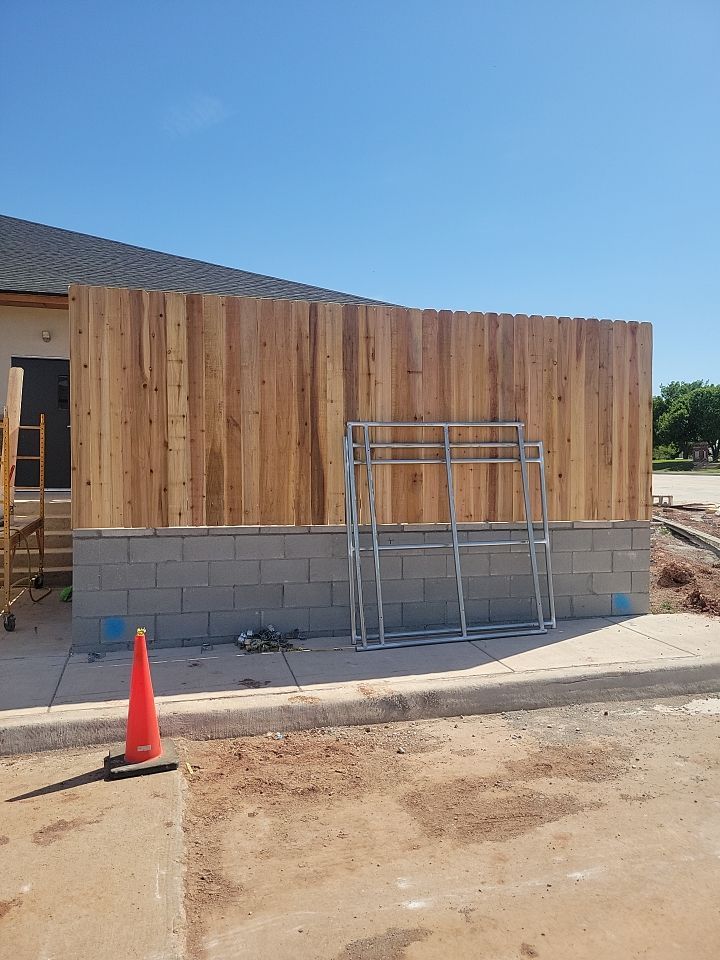 Cedar Fence using Cedar Pickets and Metal Poles by Clays Services Inc