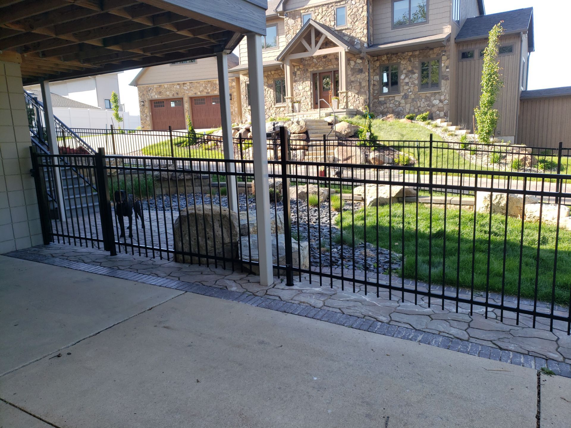 Ornamental Black Metal Picket Fence Installation in Cedar Falls by Perfect Picket Fence and Stain