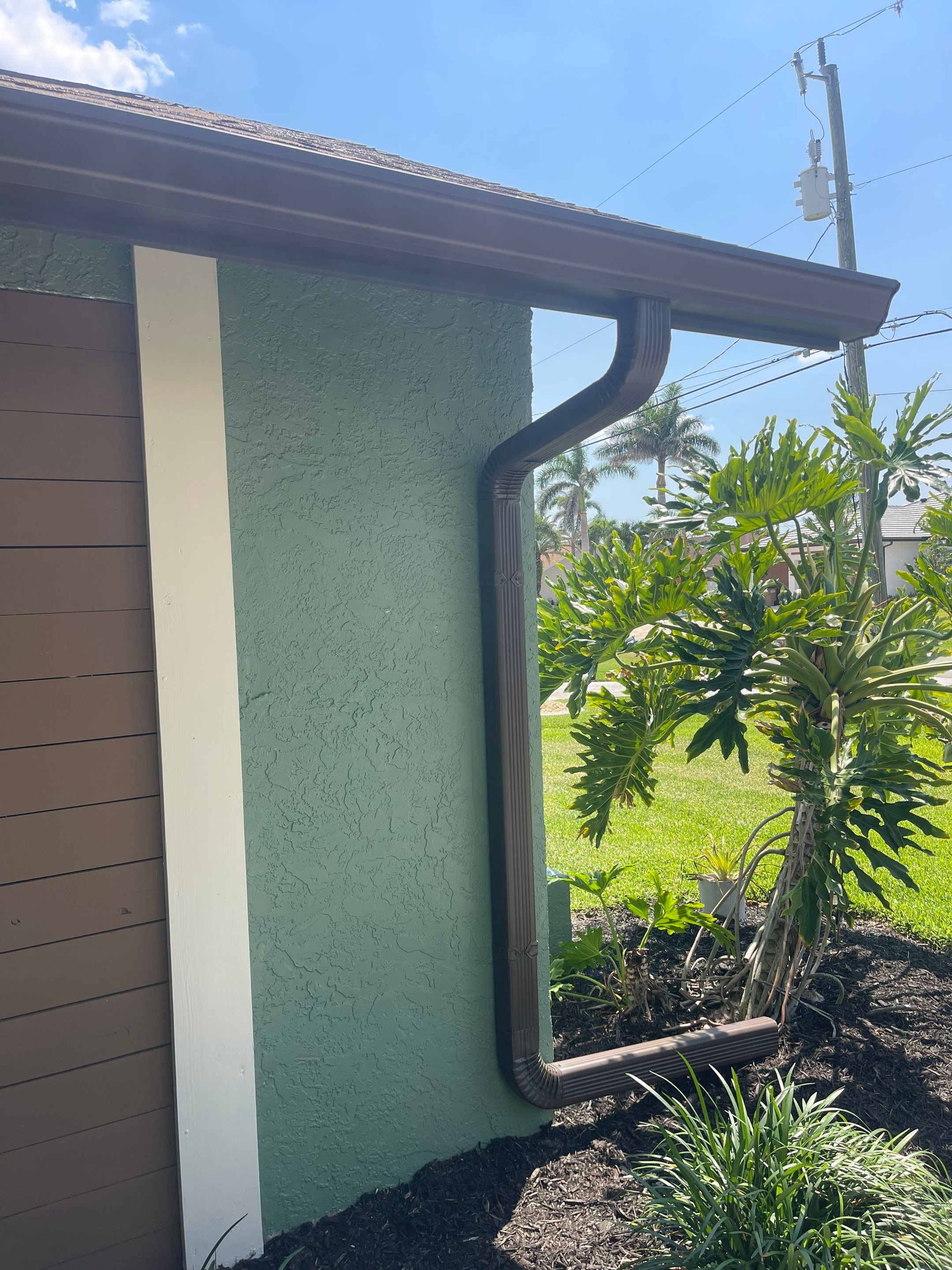 Musket Brown Seamless Gutter Installation Before Rainy Season in Cape Coral FL by Gutter Professors