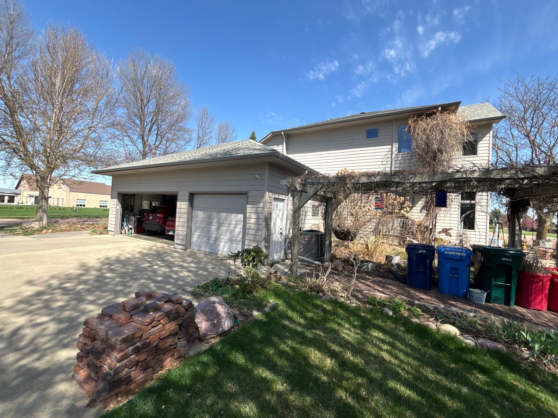 Exterior Siding and Trim Painting for Sioux Falls Residence by Select Painting, Coatings & Garage Cabinets