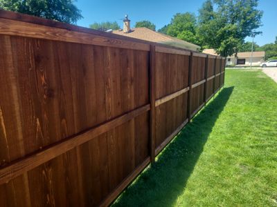 Custom Stained Cedar Chestnut Privacy Fence Installation in Cedar Falls