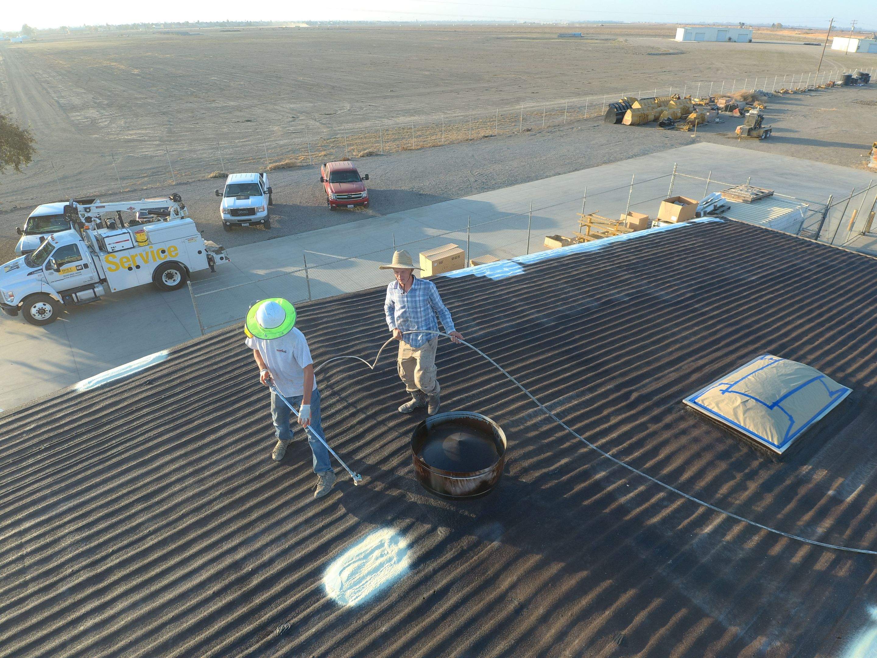Metal roof restoration on commercial roof using Conklin Benchmark/ PUMA XL acrylic coatings over metal and foam by Straight Edge Roofing Inc