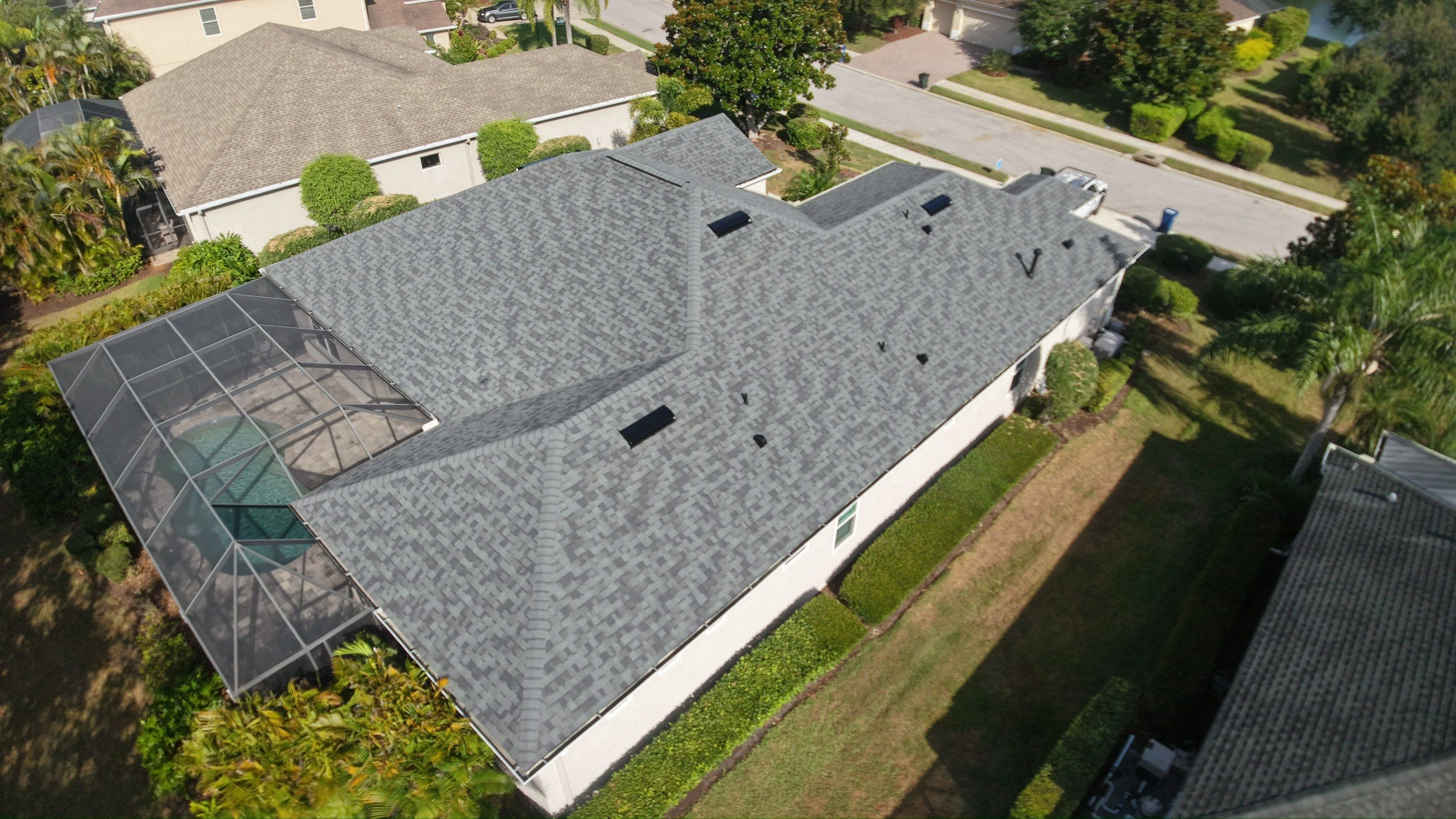 Residential Roof Installation With Estate Grey Architectural Shingles in Bradenton by Trinity Restoration and Roofing LLC