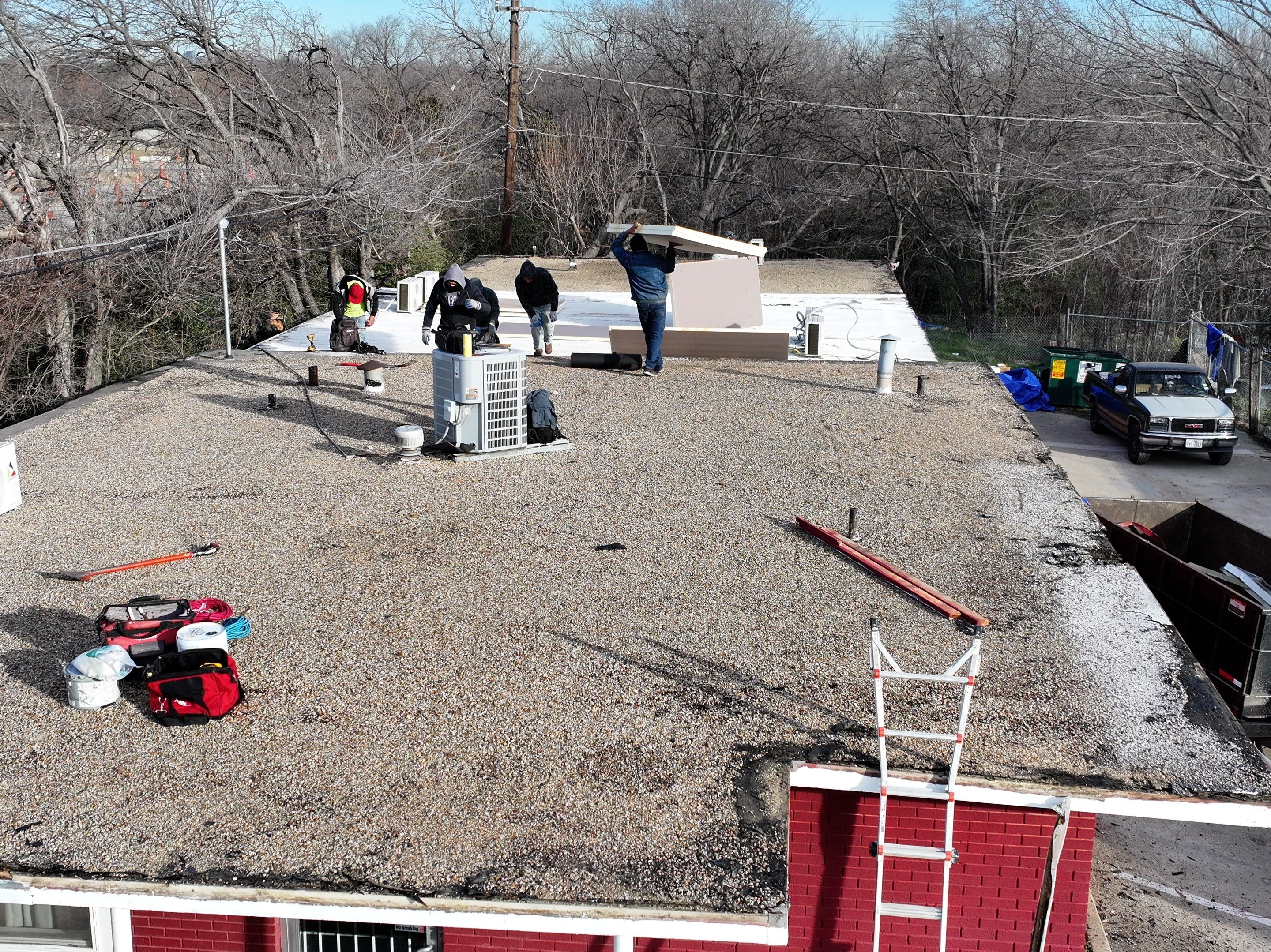 Commercial roofing overlay using GAF TPO over an old ballast roof by Becker Roofing and Exteriors