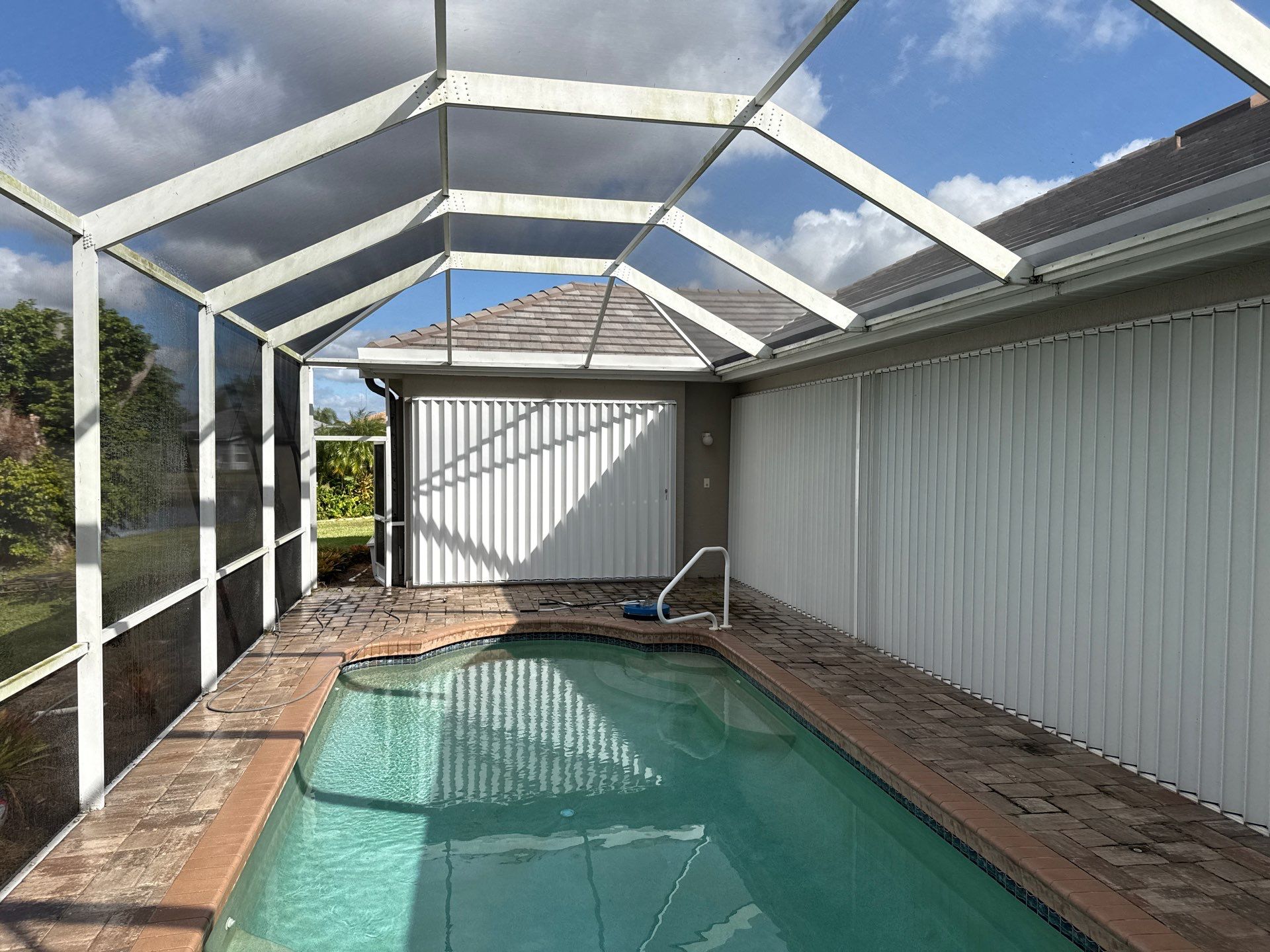 Paver Pool Deck & Screen Enclosure Transformation | University Park, Sarasota FL by Sunshine AquaWash