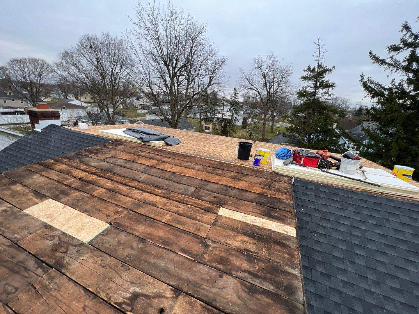 Residential Roofing Installation using 60 mil rubber roof by Nitro Roofing and Construction
