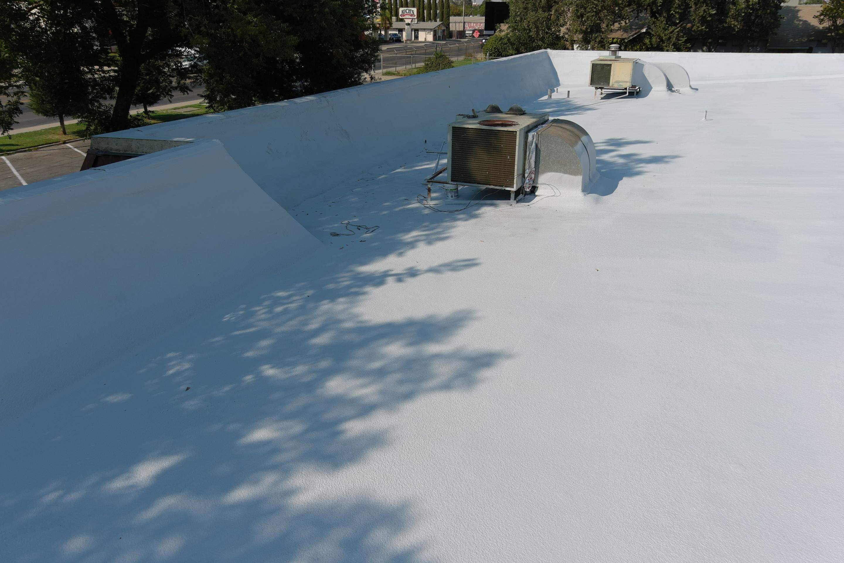 Commercial Roofing Installation using General Coatings acrylic coatings and spray foam by Straight Edge Roofing Inc