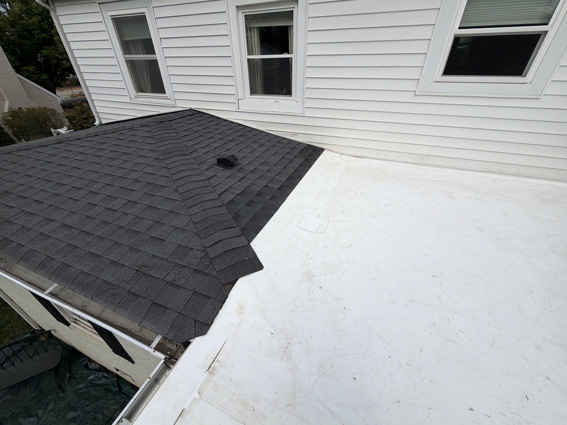 Richmond Roof Replacement Including Flat Membrane and Asphalt Shingles by Cade Construction