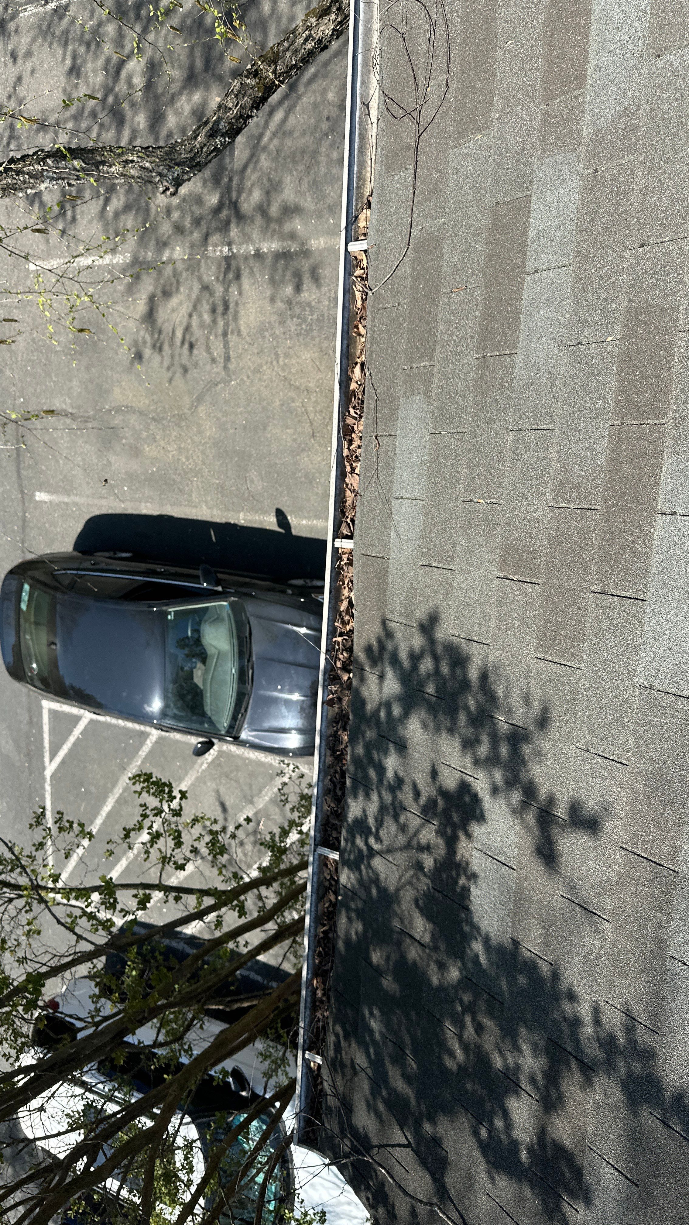 Commercial gutter cleaning Mooresville & Lake Norman, NC before photo with filled gutters