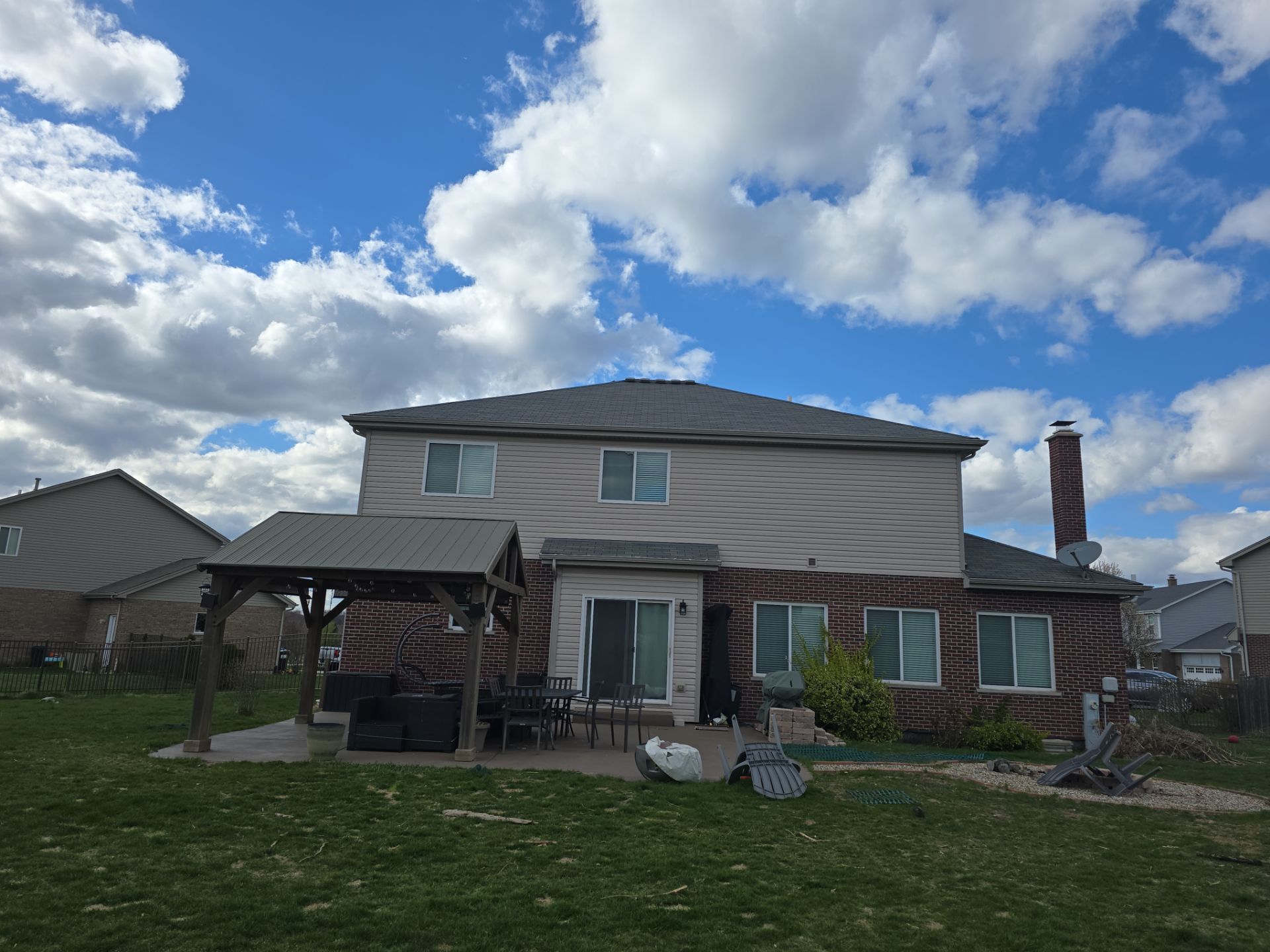 New black gutters and roof by Optimal Home Improvement 