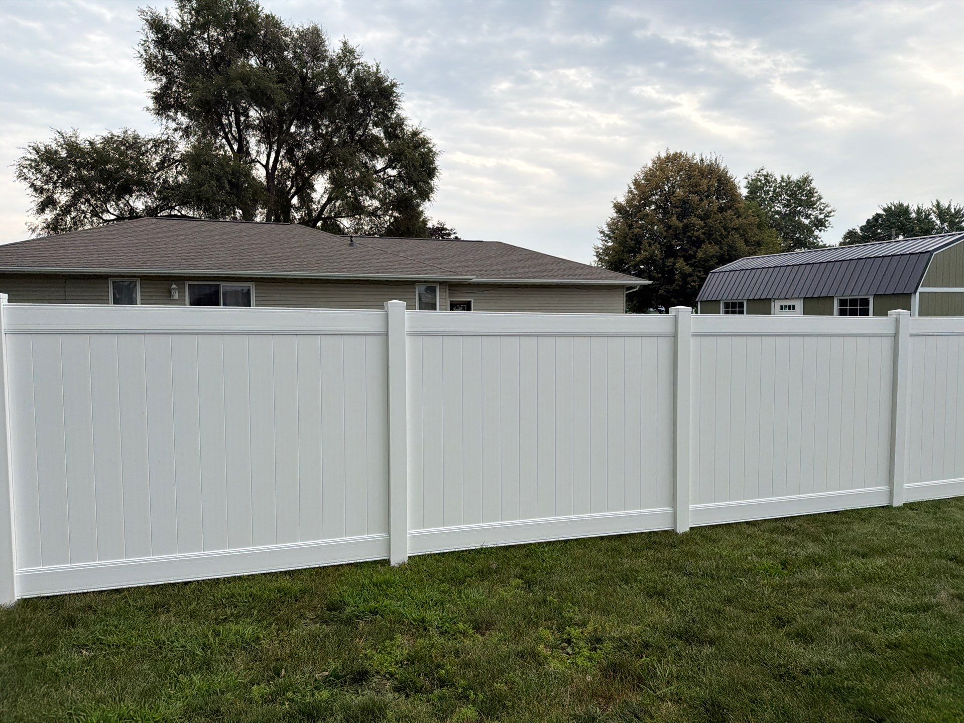 White Vinyl Privacy Fence and Double Gate Installation in Jesup by Perfect Picket Fence and Stain