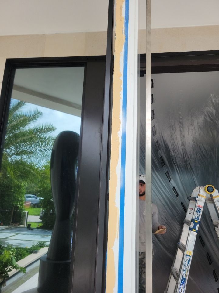Custom Material Pivot Door installation by Impact Precious Windows and Doors
