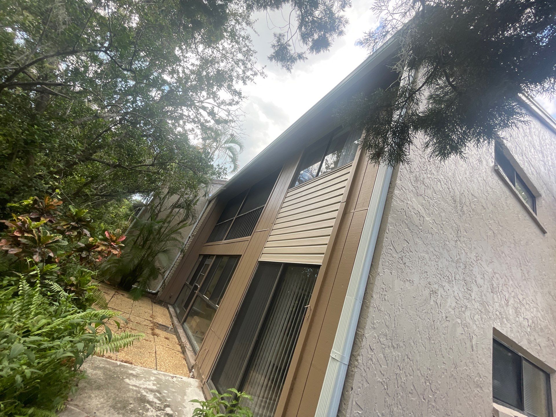 Clean Gutters and Roof in Sarasota FL by Gutter Professors