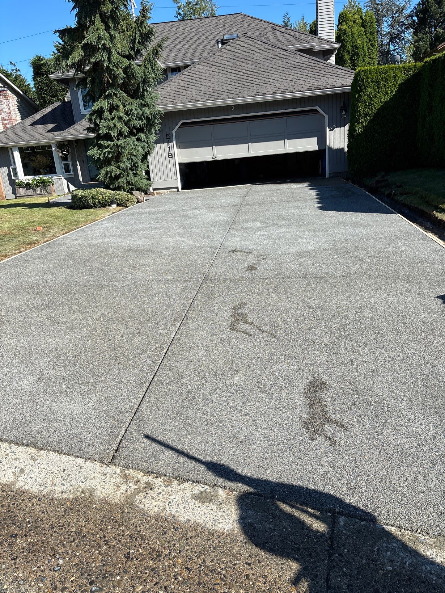 Exposed Aggregate Concrete Driveway Makeover  by Jireh Asphalt & Concrete Inc 