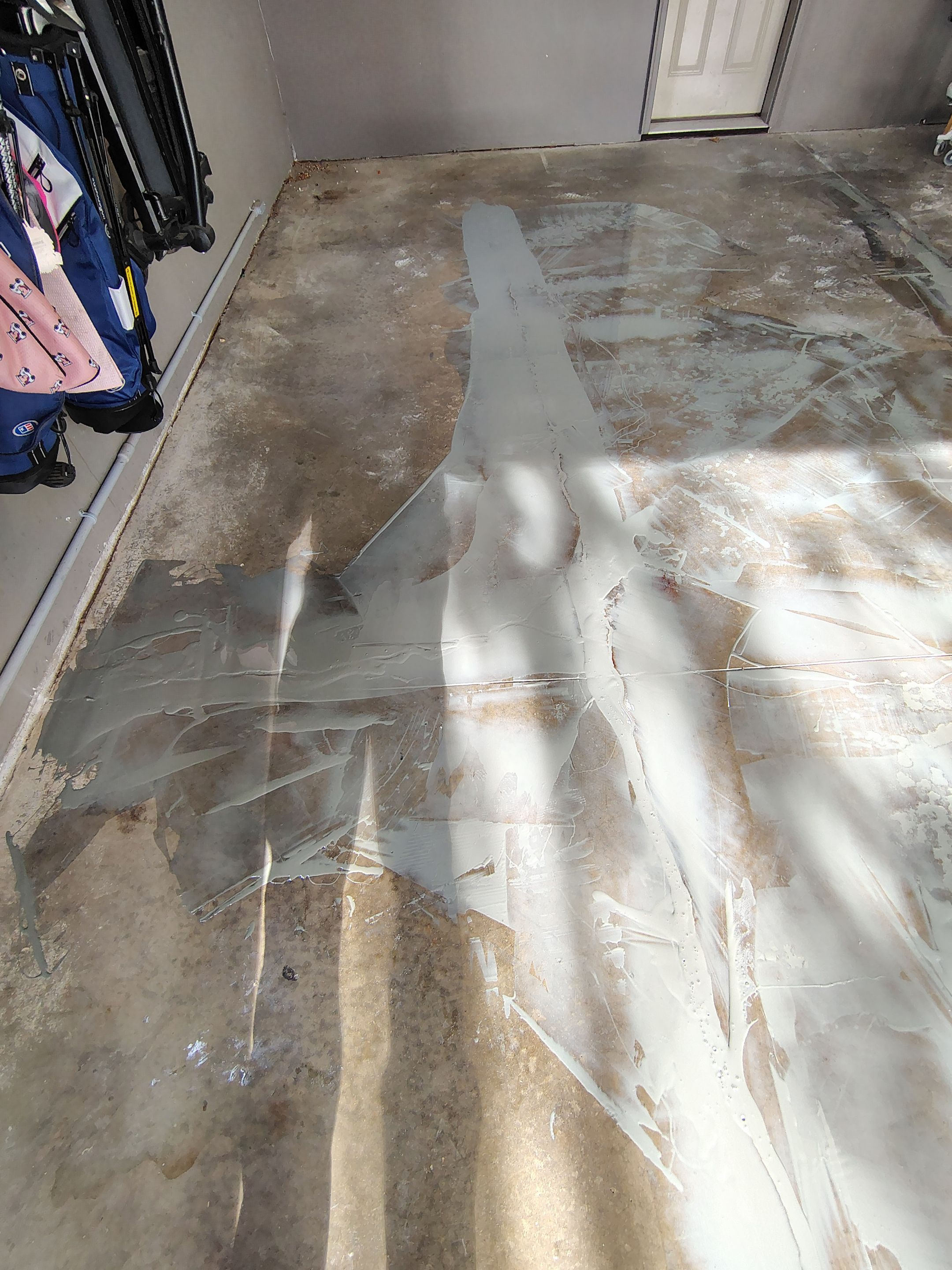 Garage Floor Concrete Coating and Crack Repair in Sioux Falls by Select Painting, Coatings & Garage Cabinets