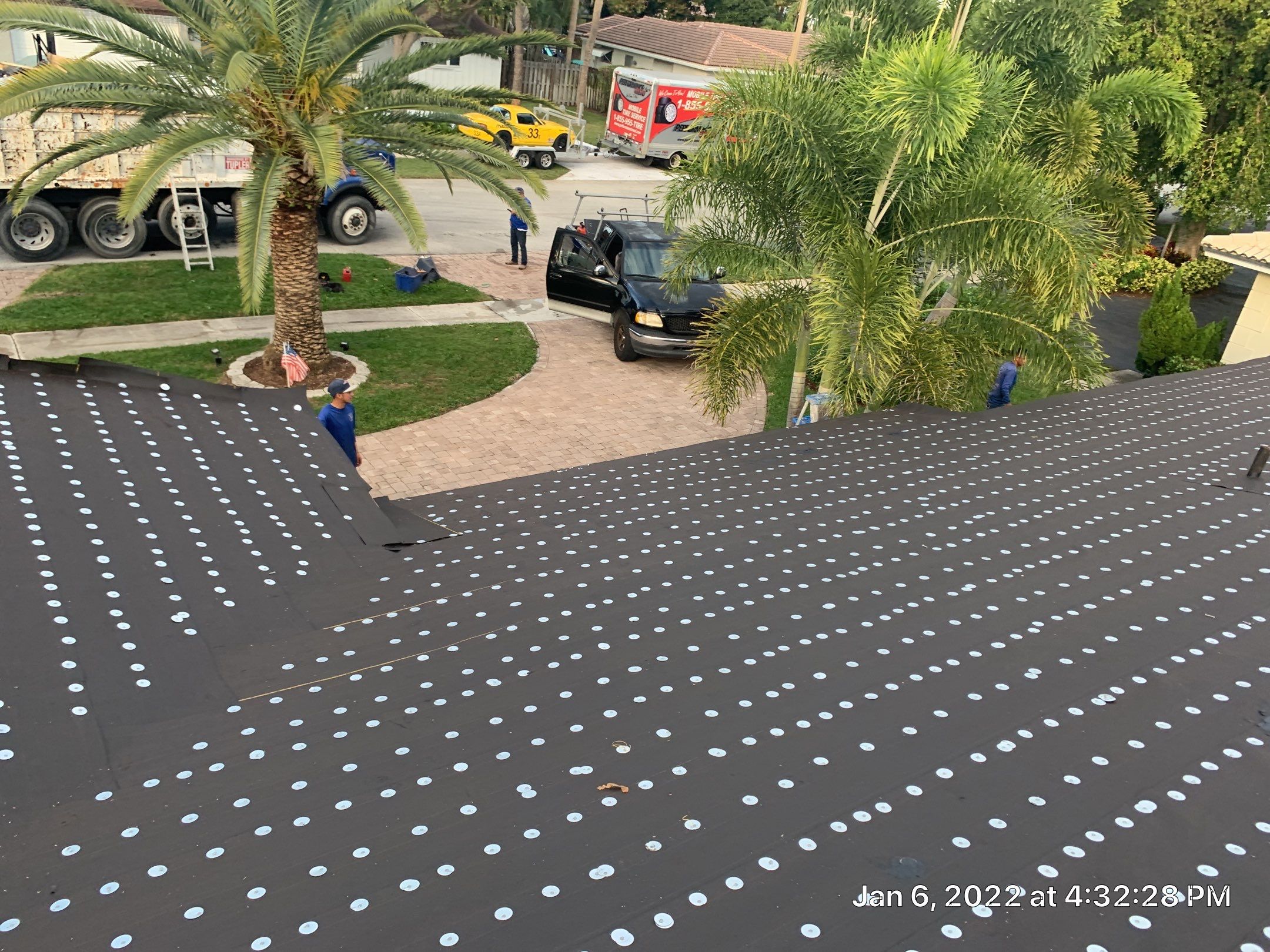 Residential Roofing Installation using 1" Nail strip metal roof by BLUES BROTHERS CONSTRUCTION CORP