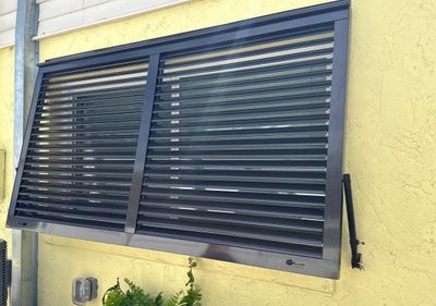 Hurricane Rated Bahama Shutters in Grey Brown