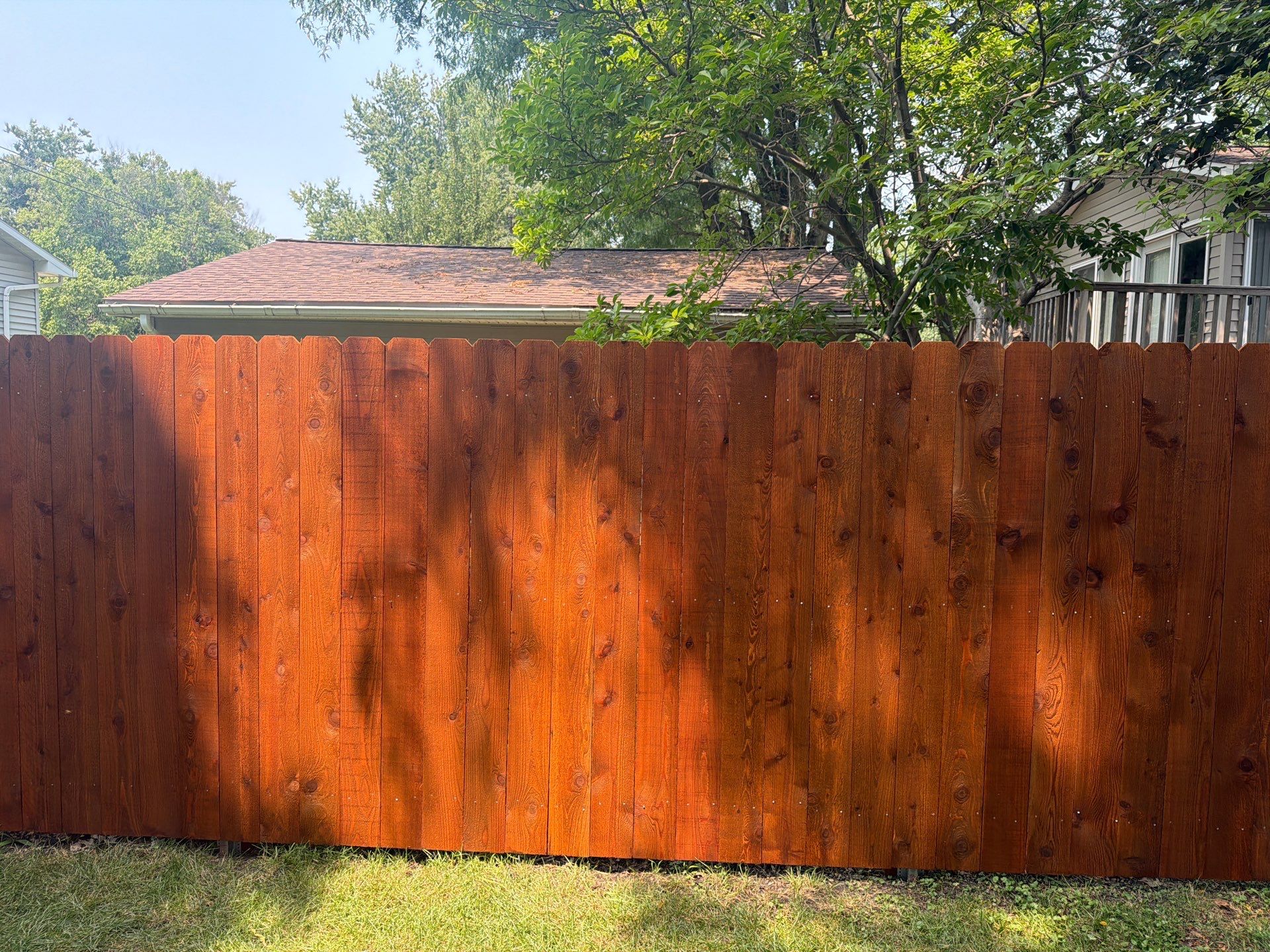 Pecan Cedar Privacy Fence Installation with Scalloped Top in Cedar Falls by Perfect Picket Fence and Stain