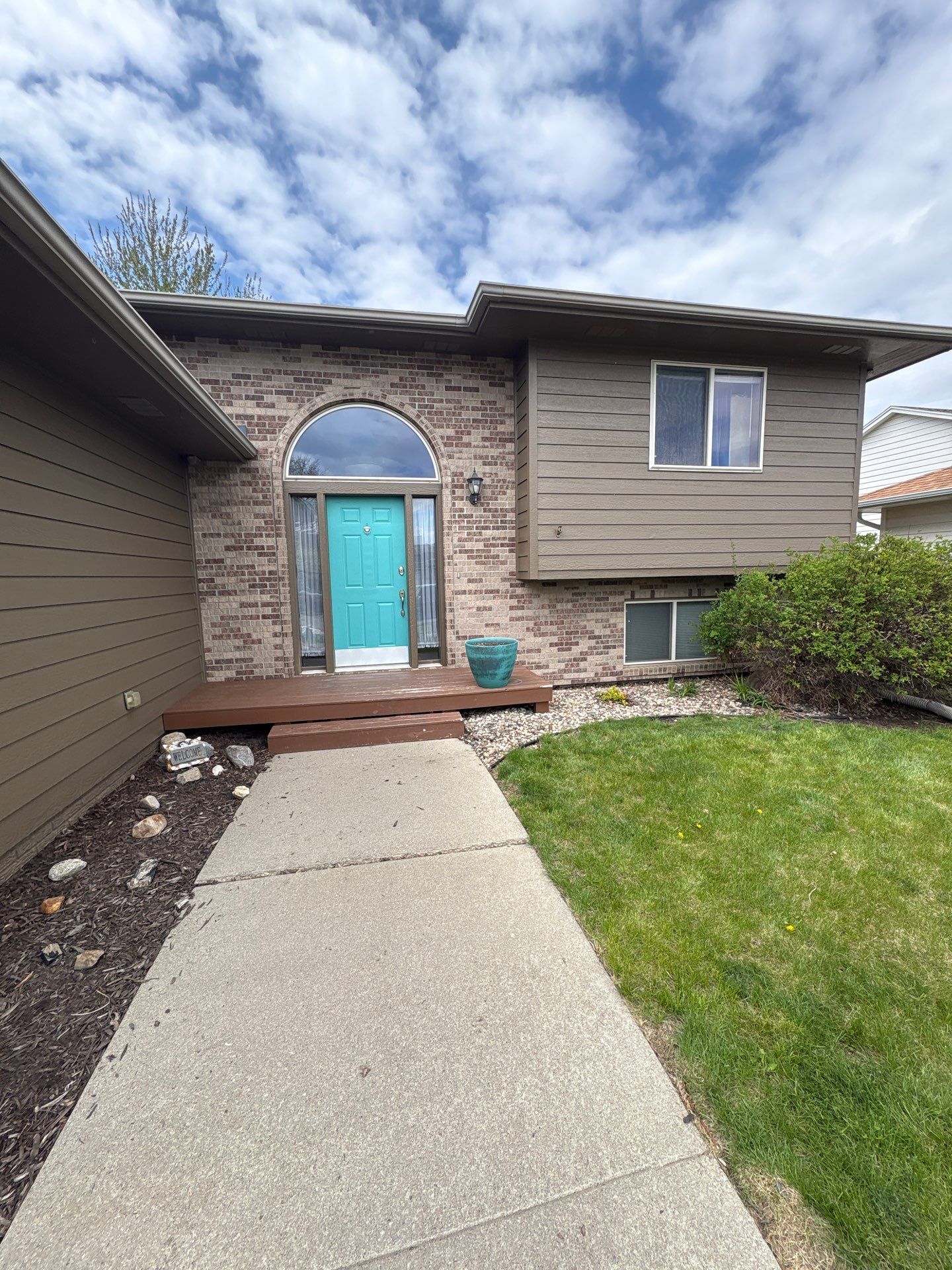 Exterior Painting and Wood Trim Replacement in Sioux Falls by Select Painting, Coatings & Garage Cabinets
