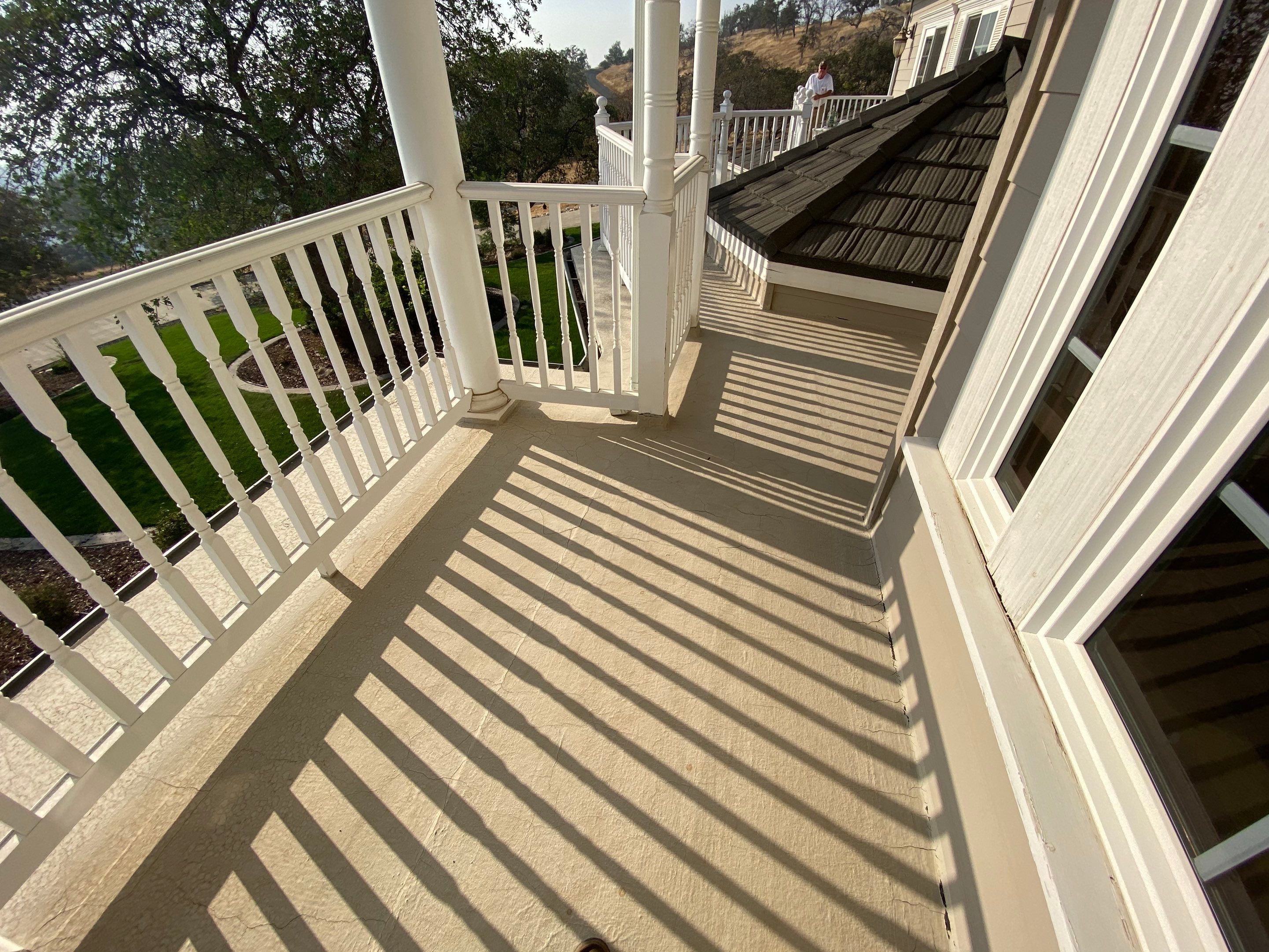 Sealant system over walk deck over house using Rubber coat and coatings by Straight Edge Roofing Inc
