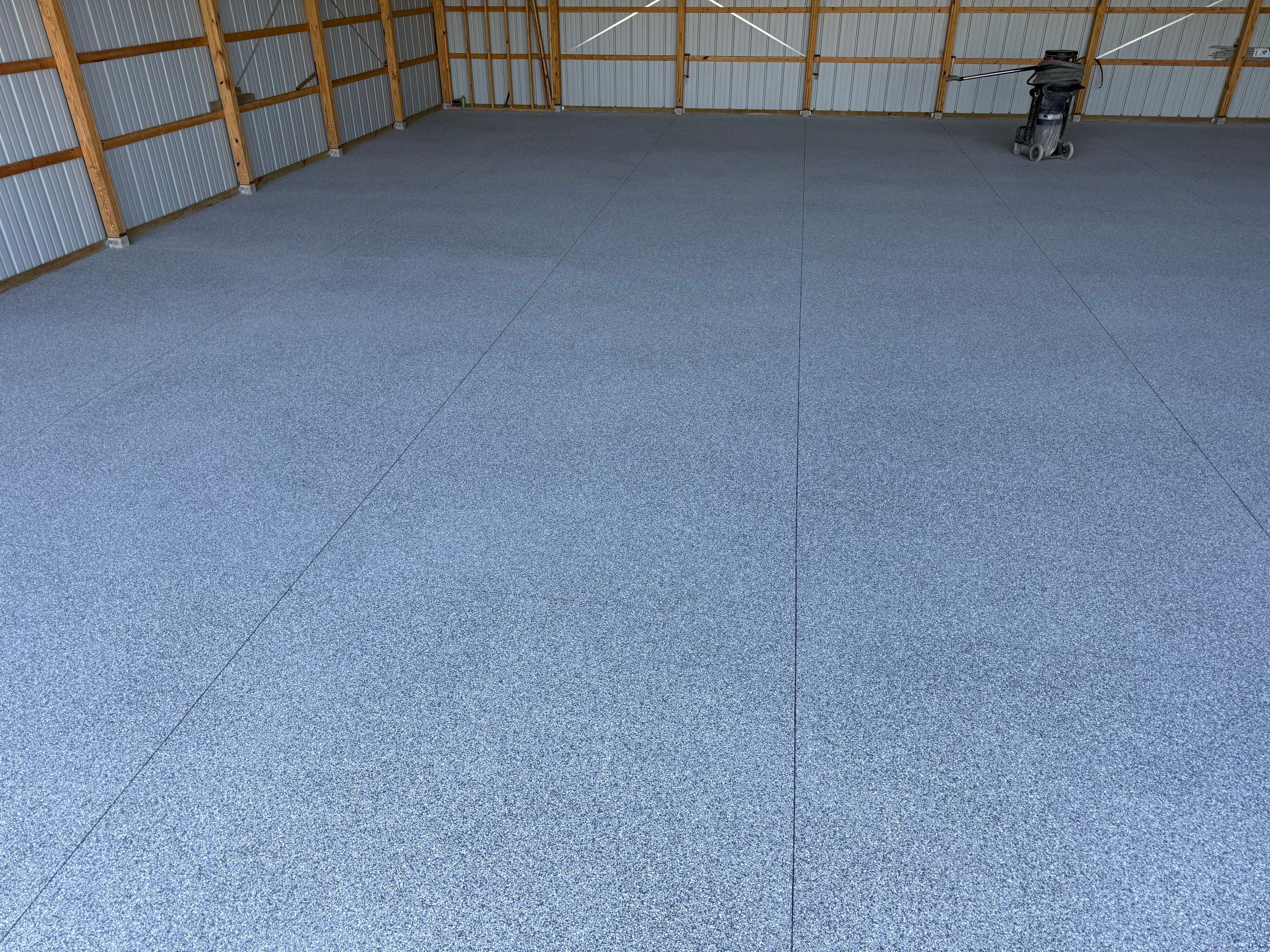 Durable Grey Speckled Epoxy Floor Coating for Yankton Shop by Select Painting, Coatings & Garage Cabinets