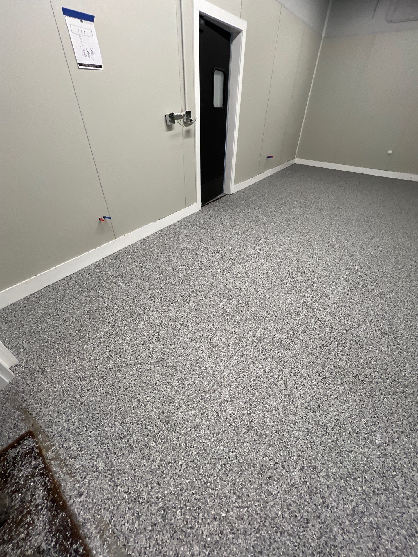 Silverado garage floor coating  by NG Masonry & Construction LLC