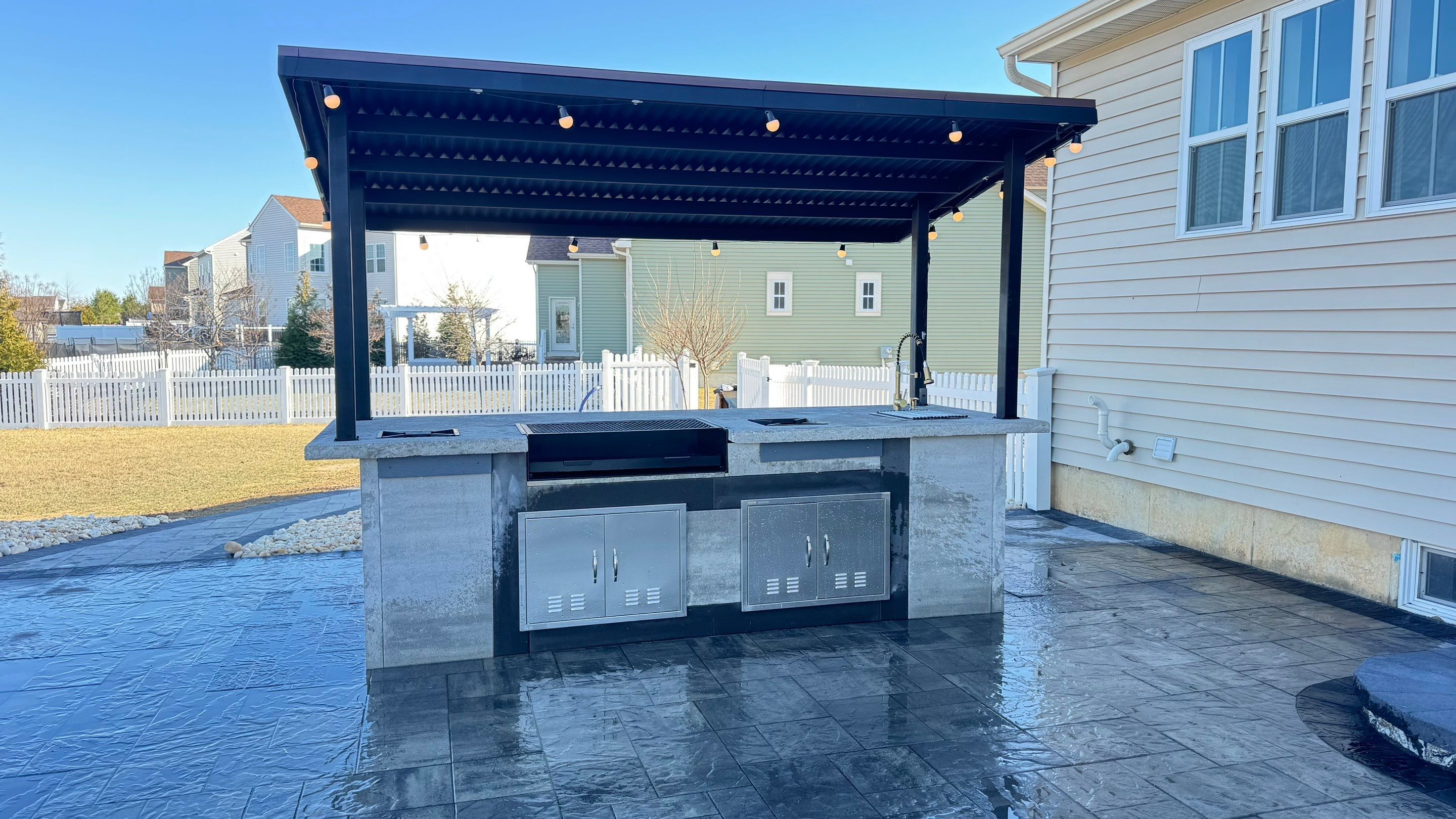 Custom Belgard patio by Studio G Indoor Spaces & Outdoor Living