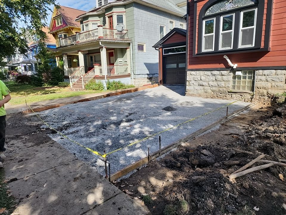 Exterior Renovations- Siding, Stamped Concrete, Porch, and Railings by Ivy Lea Construction