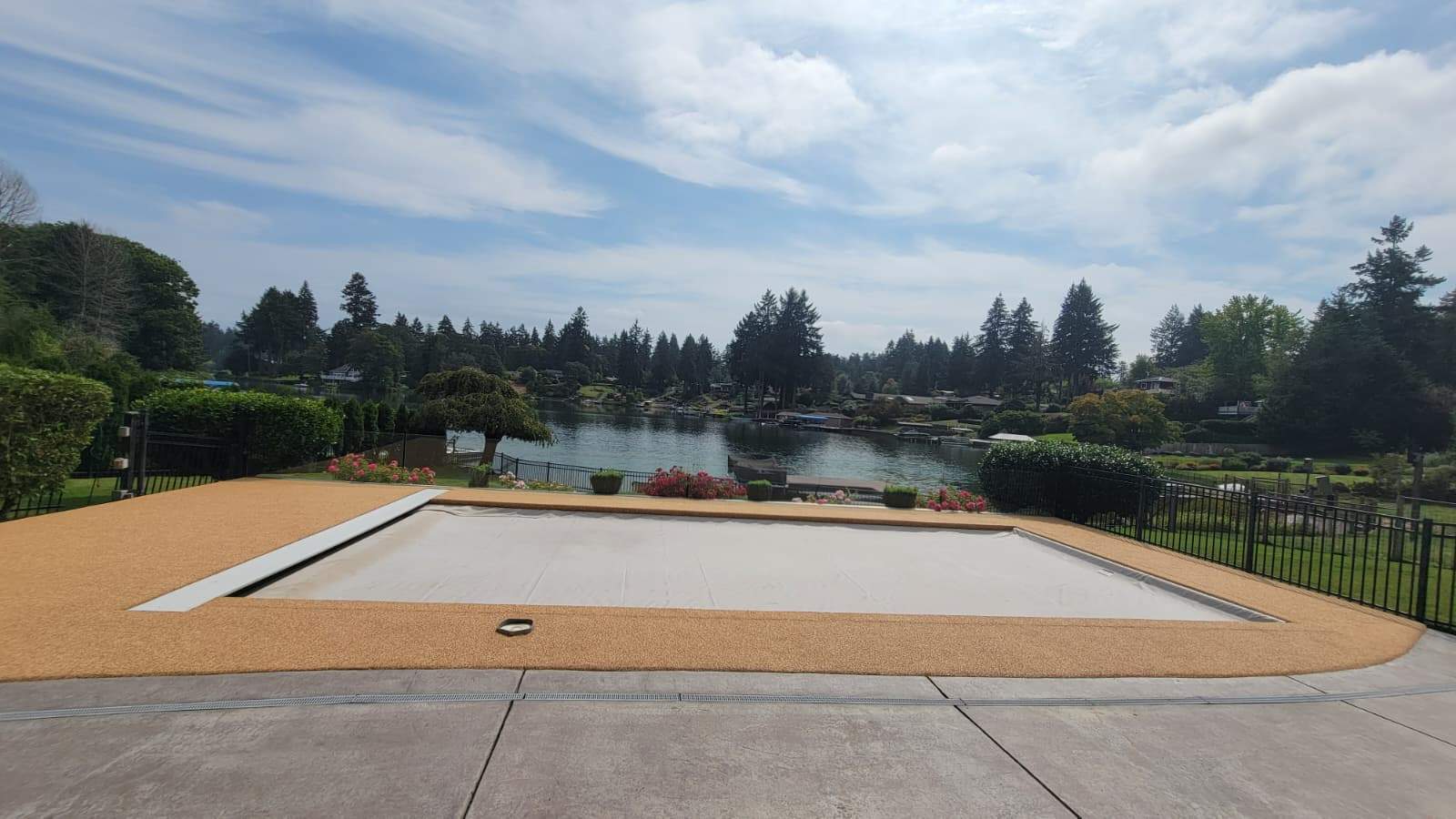 Pool Deck with Rubber Stone Finish by Concrete Coating Experts Inc.