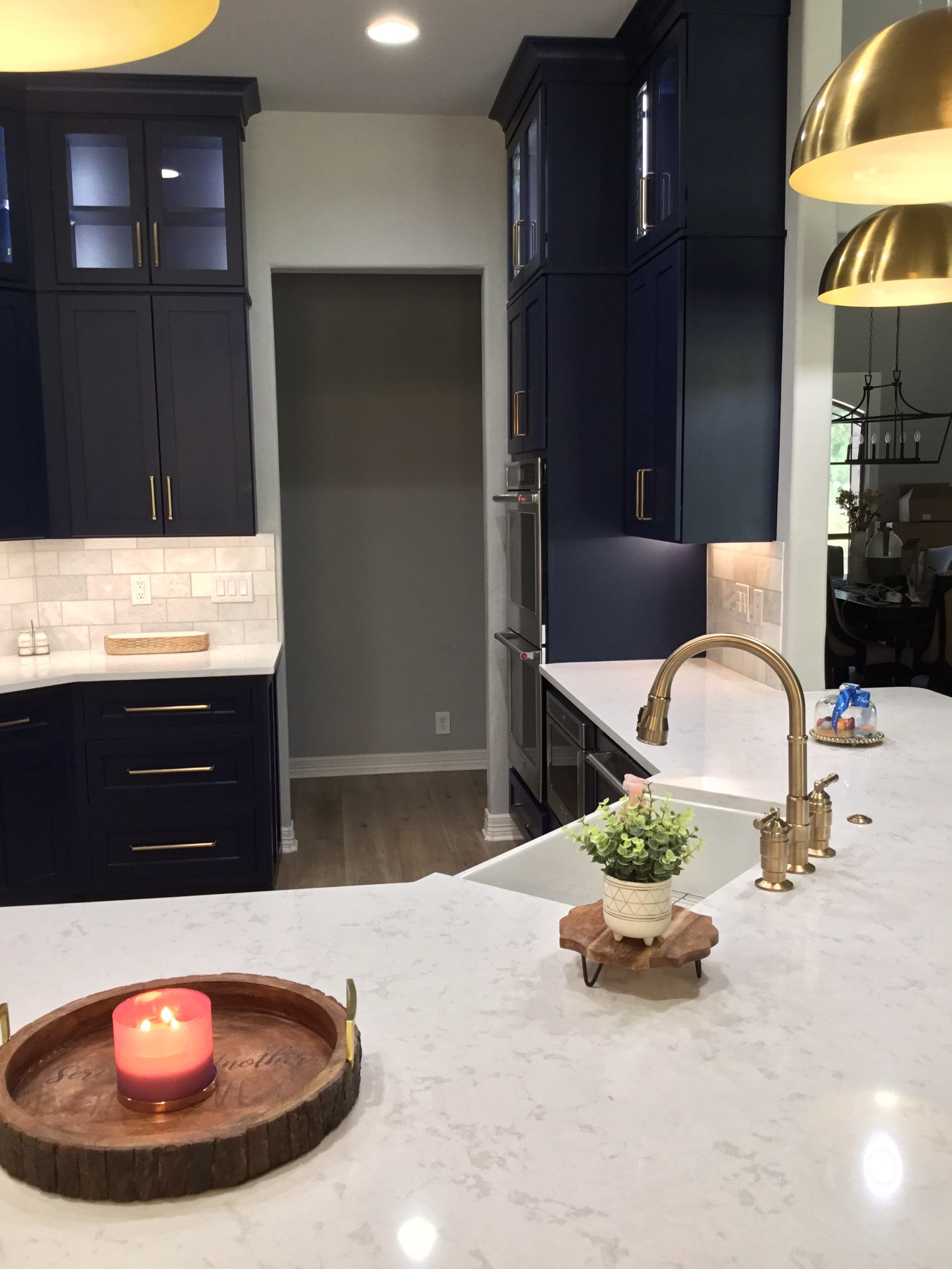 Spring Branch Kitchen Remodel | Custom Navy Cabinetry & Wood Range Hood by Legacy Bath and Kitchen