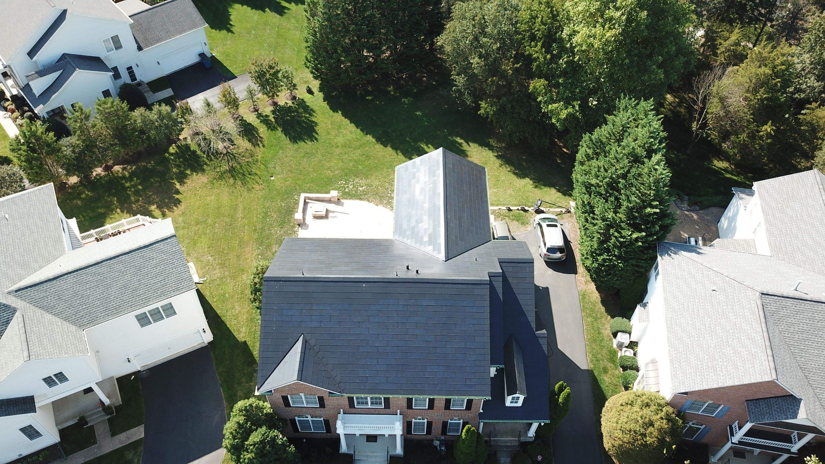 Tesla Solar Roof Replacement using Tesla Solar Roof V3 tiles by American Home Contractors