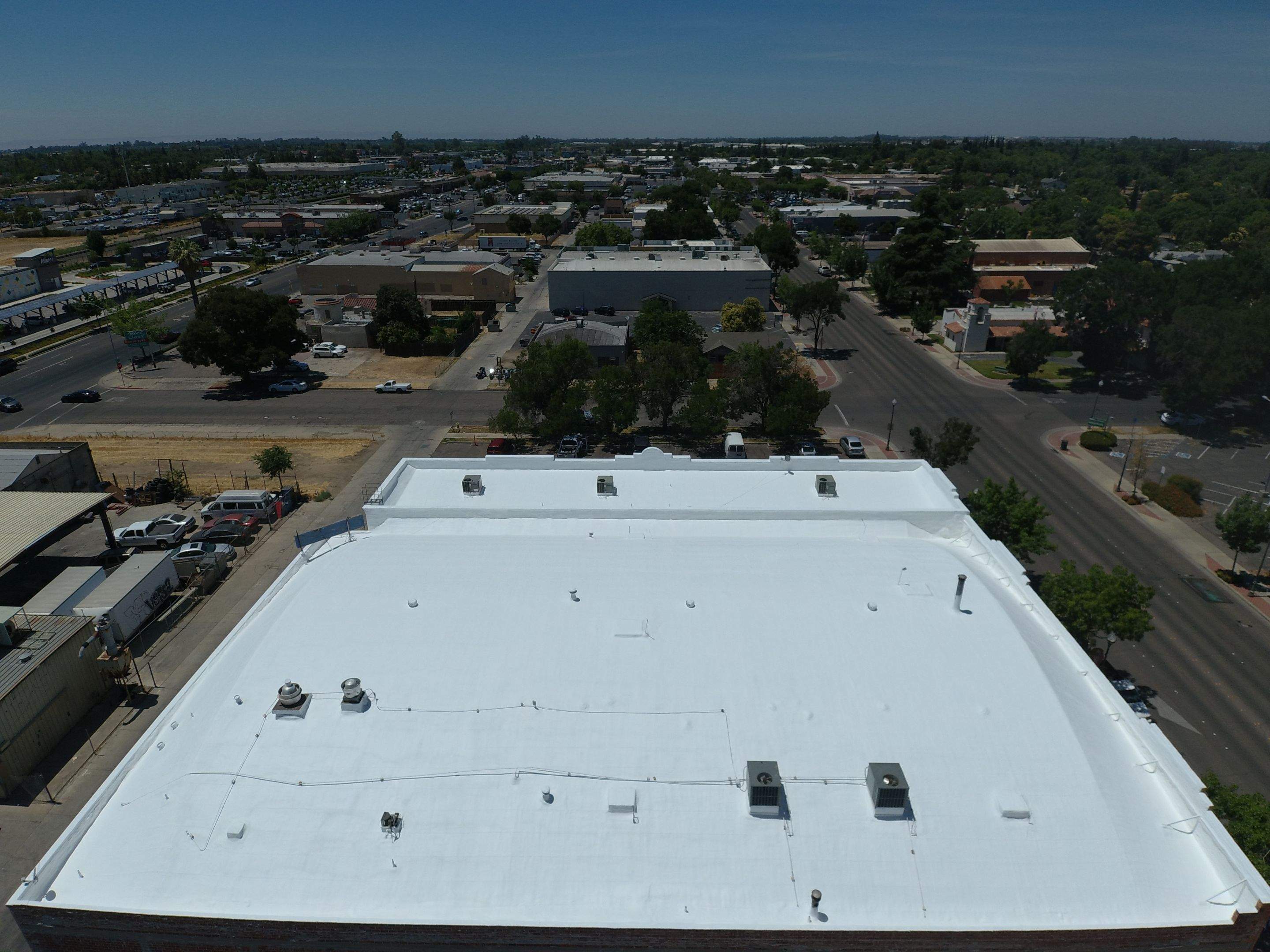 Spray foam and coatings using Conklin Benchmark/PUMA XL coatings and spray foam by Straight Edge Roofing Inc