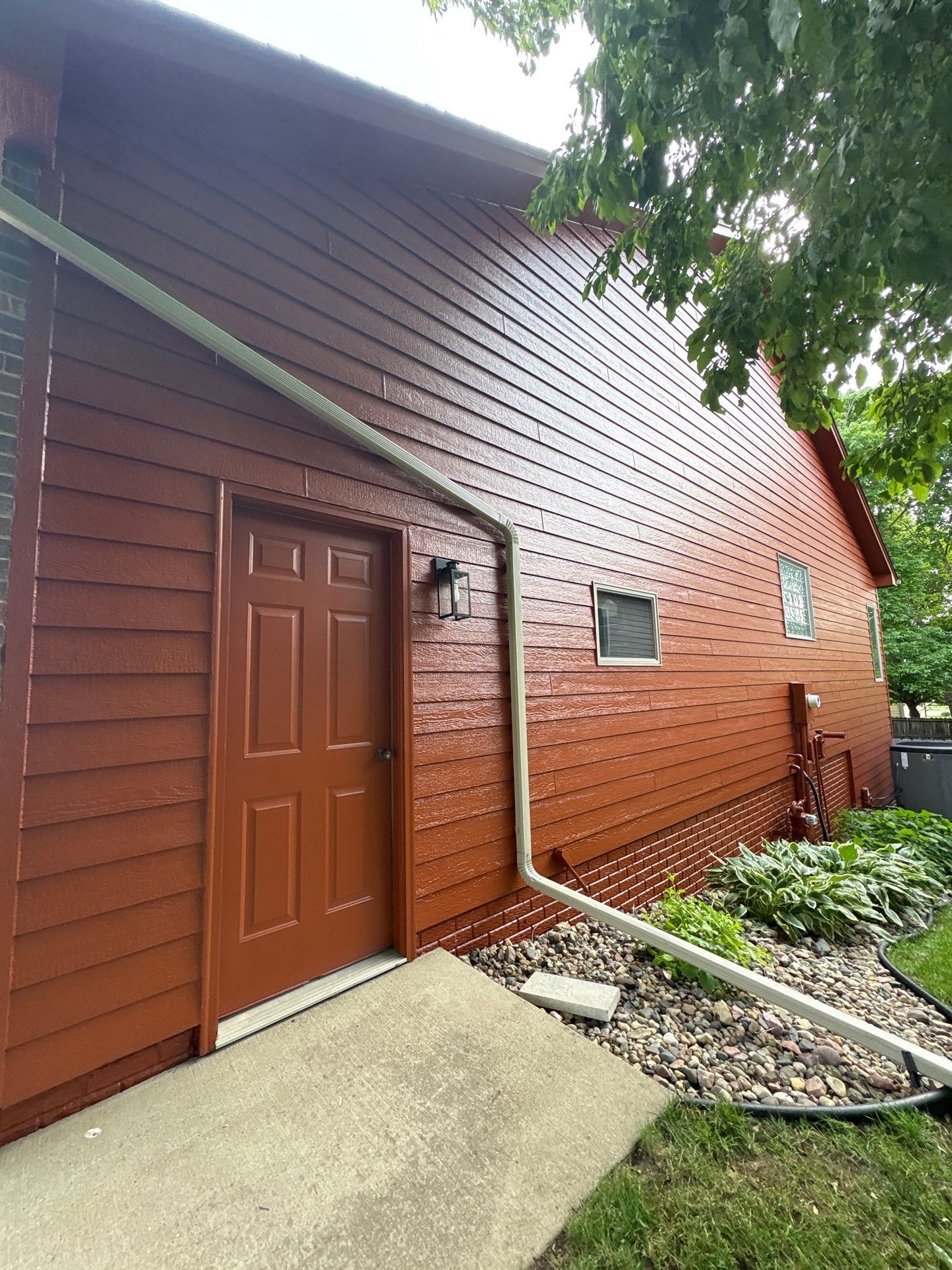 Full Exterior Home Repaint and Siding Refresh in Sioux Falls by Select Painting, Coatings & Garage Cabinets