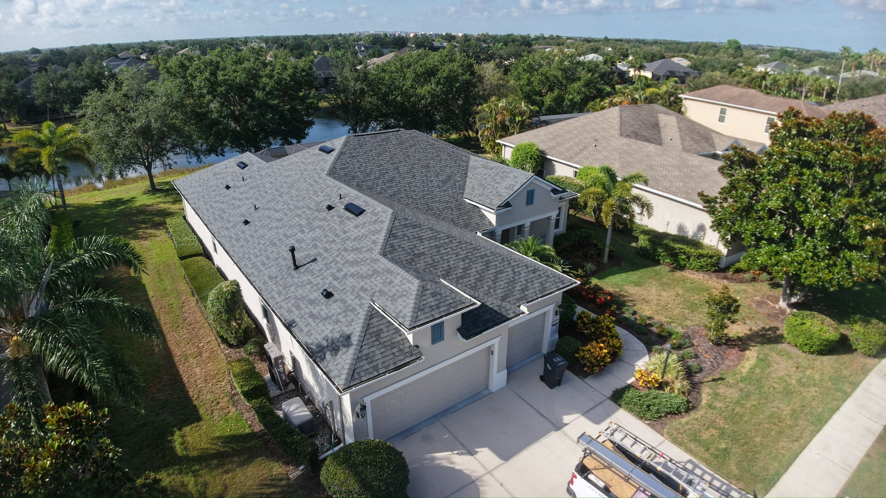 Residential Roof Installation With Estate Grey Architectural Shingles in Bradenton by Trinity Restoration and Roofing LLC
