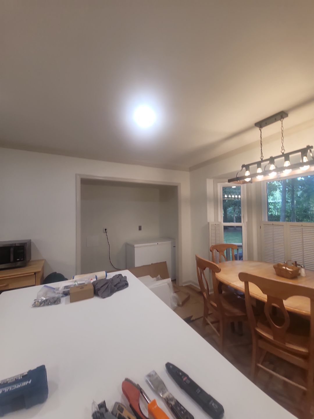 A Pathway to Personality – A Two-Tone Kitchen Transformation in Apex by Elite Remodeling and Design LLC
