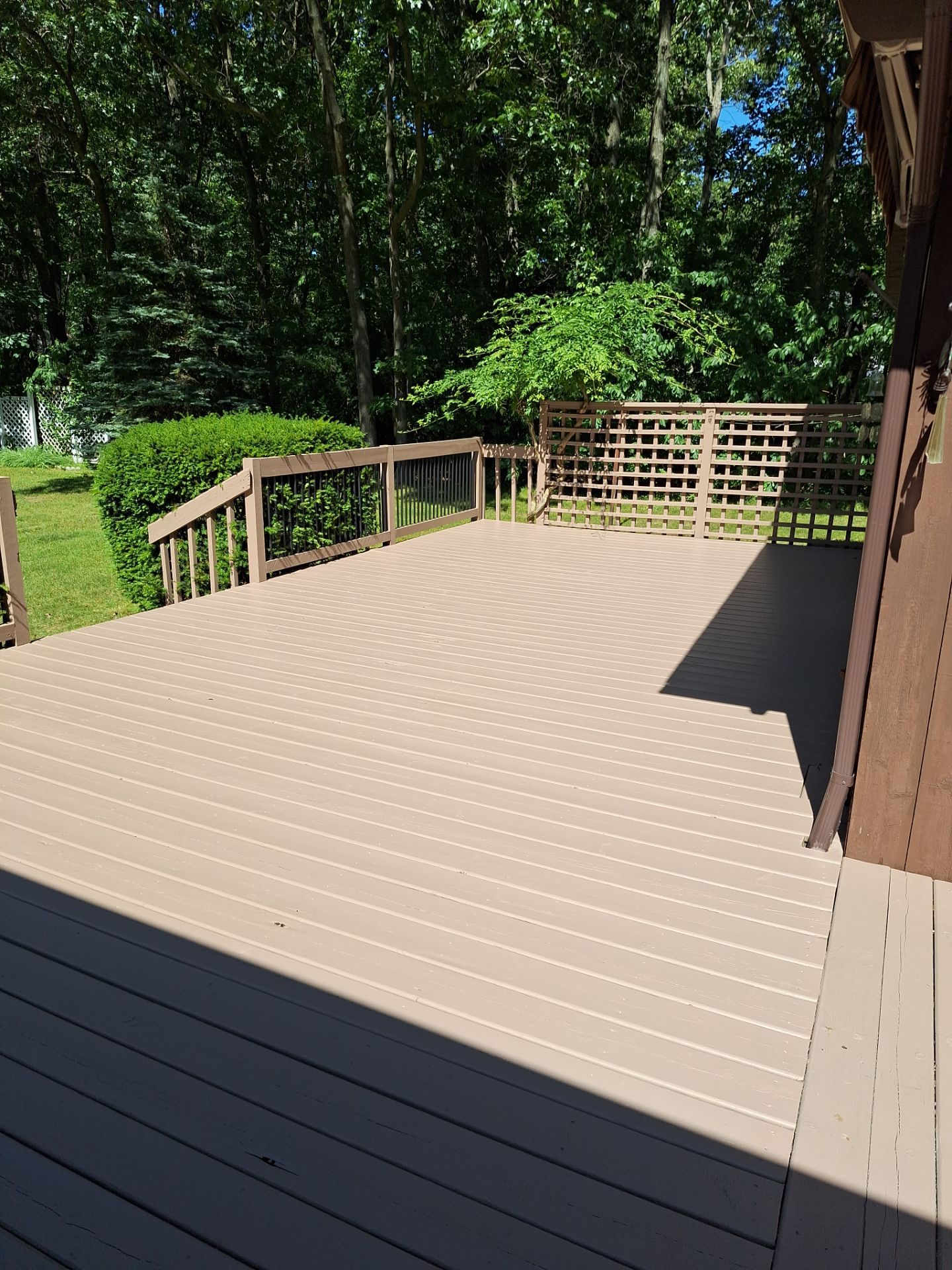 Muskegon Deck Restoration with Pressure Treated Railings and Wood Staining by Gordon Painting