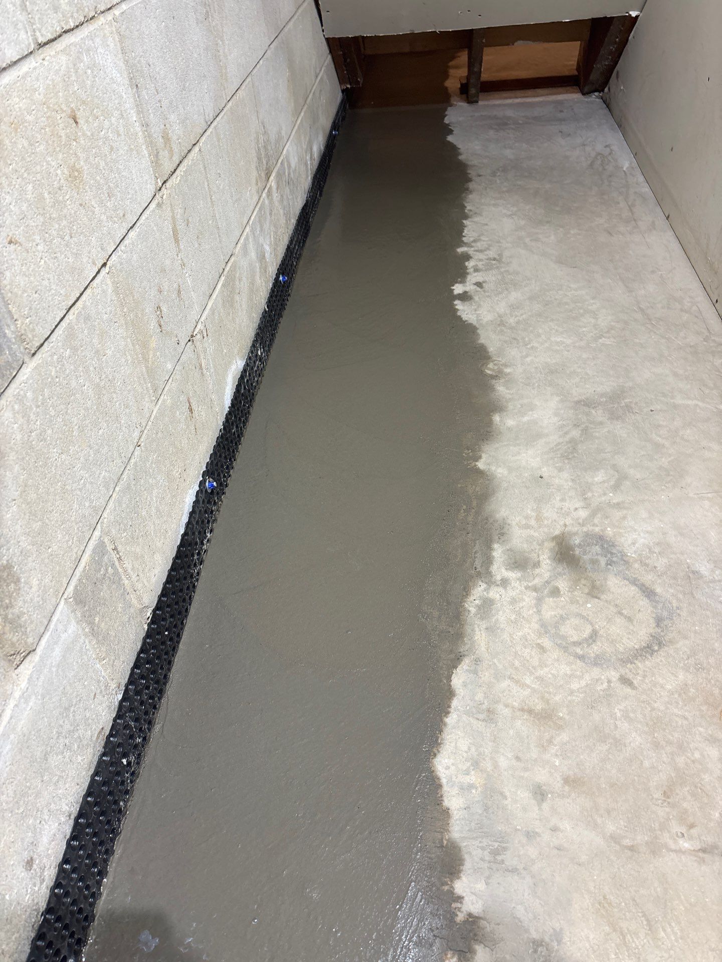 Interior Drain Tile Installation in Minnetonka, MN by Waterproofing Northeast